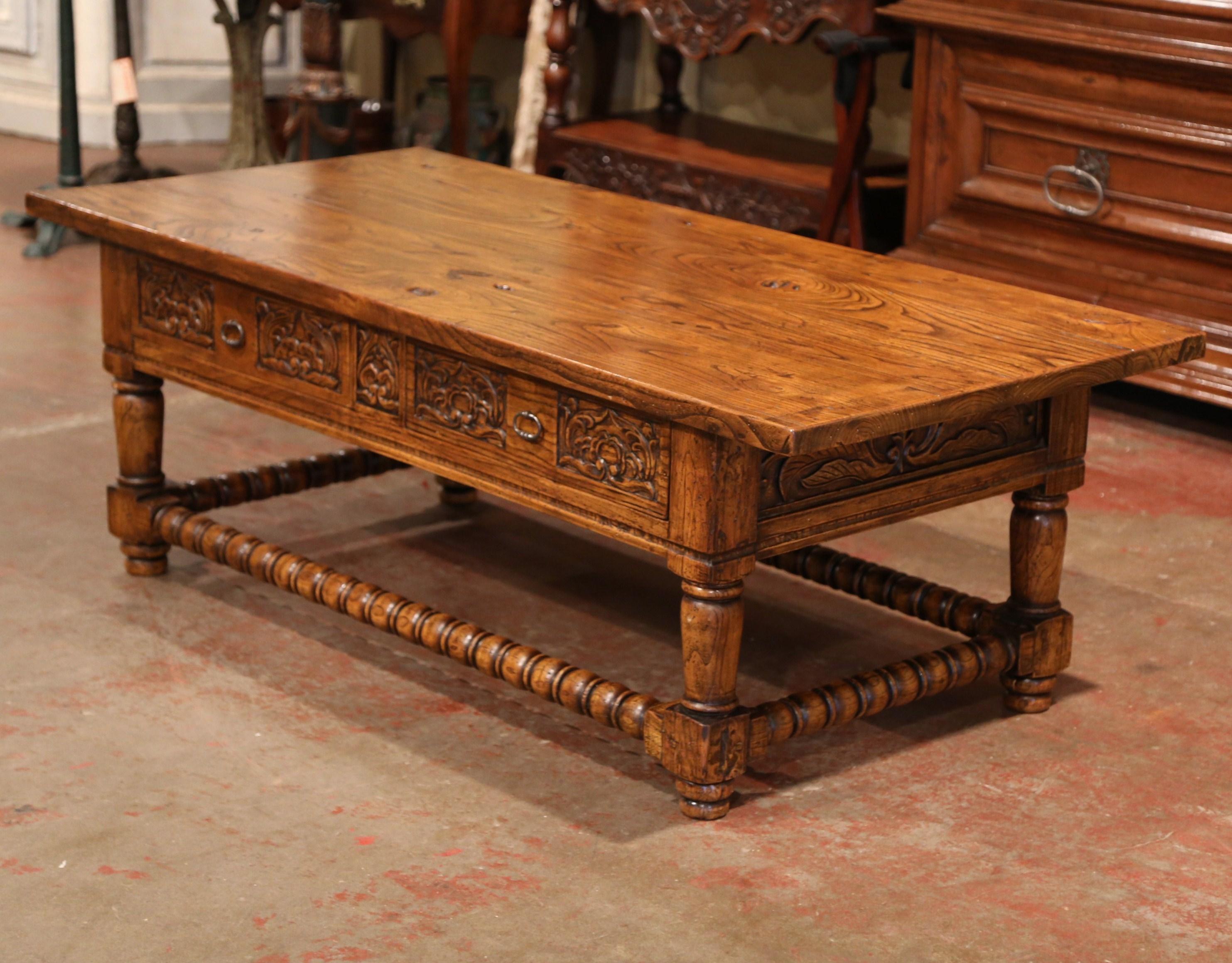 This elegant, chestnut antique cut down table was crafted in the Pyrenees, the southern mountains of France, circa 1920. Intricately carved on the front and sides, this cocktail table features four thick turned legs, attached at the base with a