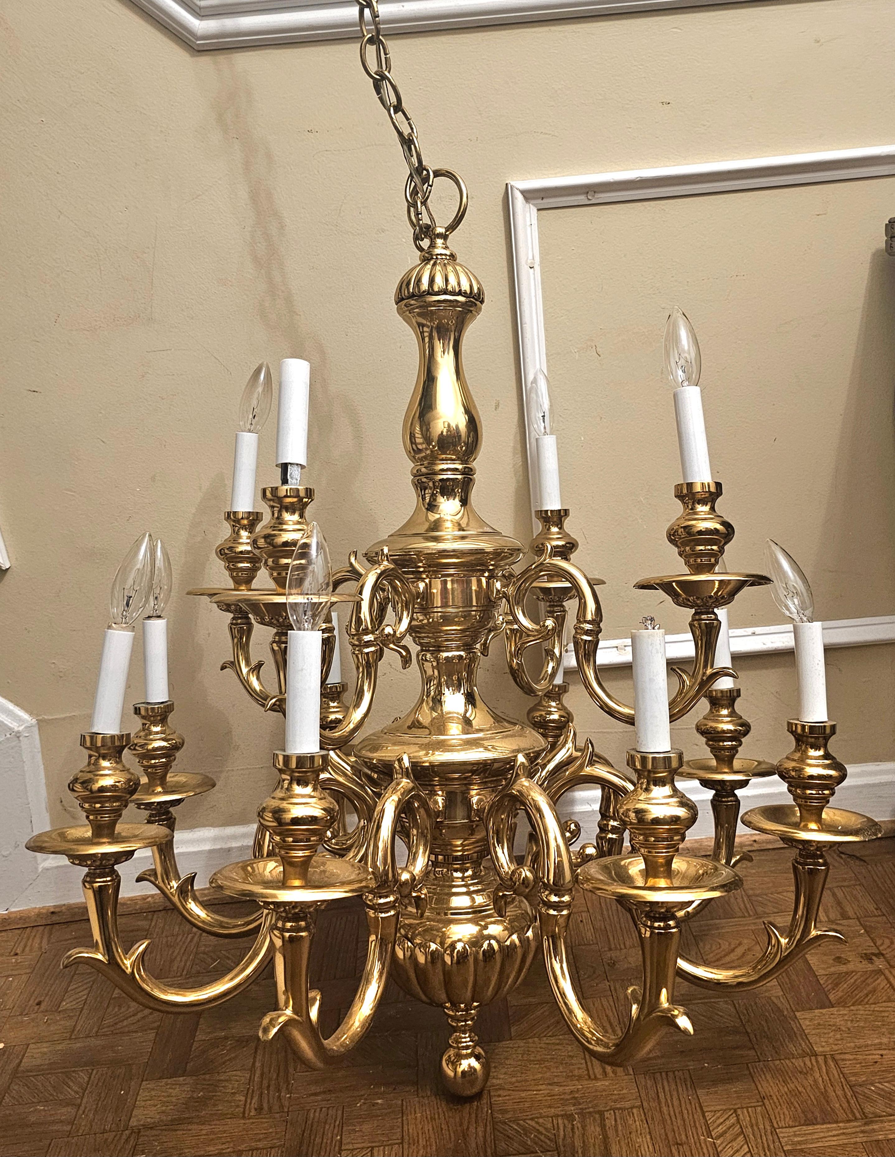 Early 20th Century French Louis XIV Style Twelve Branch Heavy cast Brass and Ormolu Chandelier. Great vintage condition. This heavy cast brass Jewel will not rust. 
Measures 28