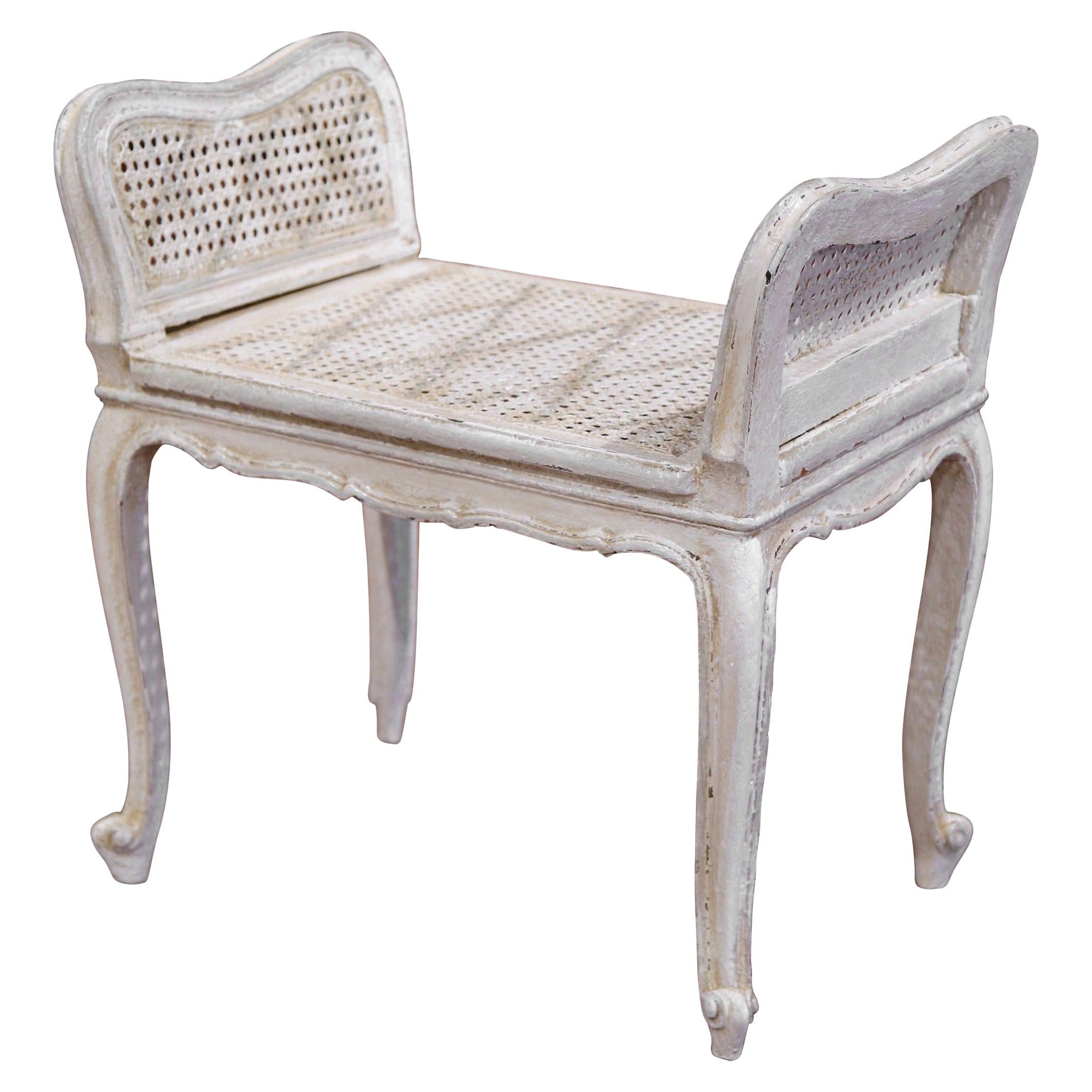 Early 20th Century French Louis XV Carved Painted Bench with Cane Seating
