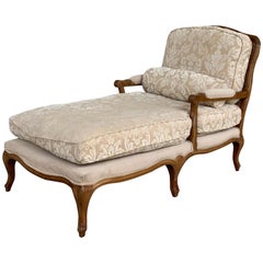 Early 20th Century French Louis XV Carved Walnut Chase Longue with Cane Back