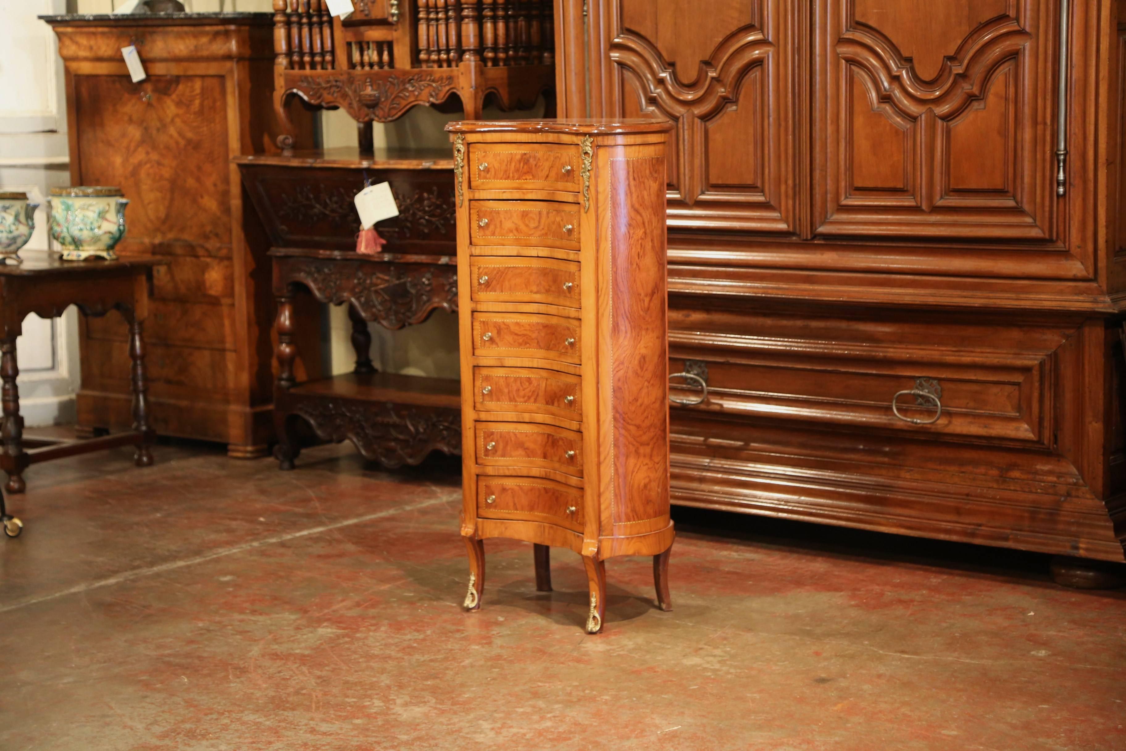 Place this tall multi-drawer cabinet in your bedroom or bathroom for extra storage. Crafted in France, circa 1920 and shaped as a kidney, the fruit wood 