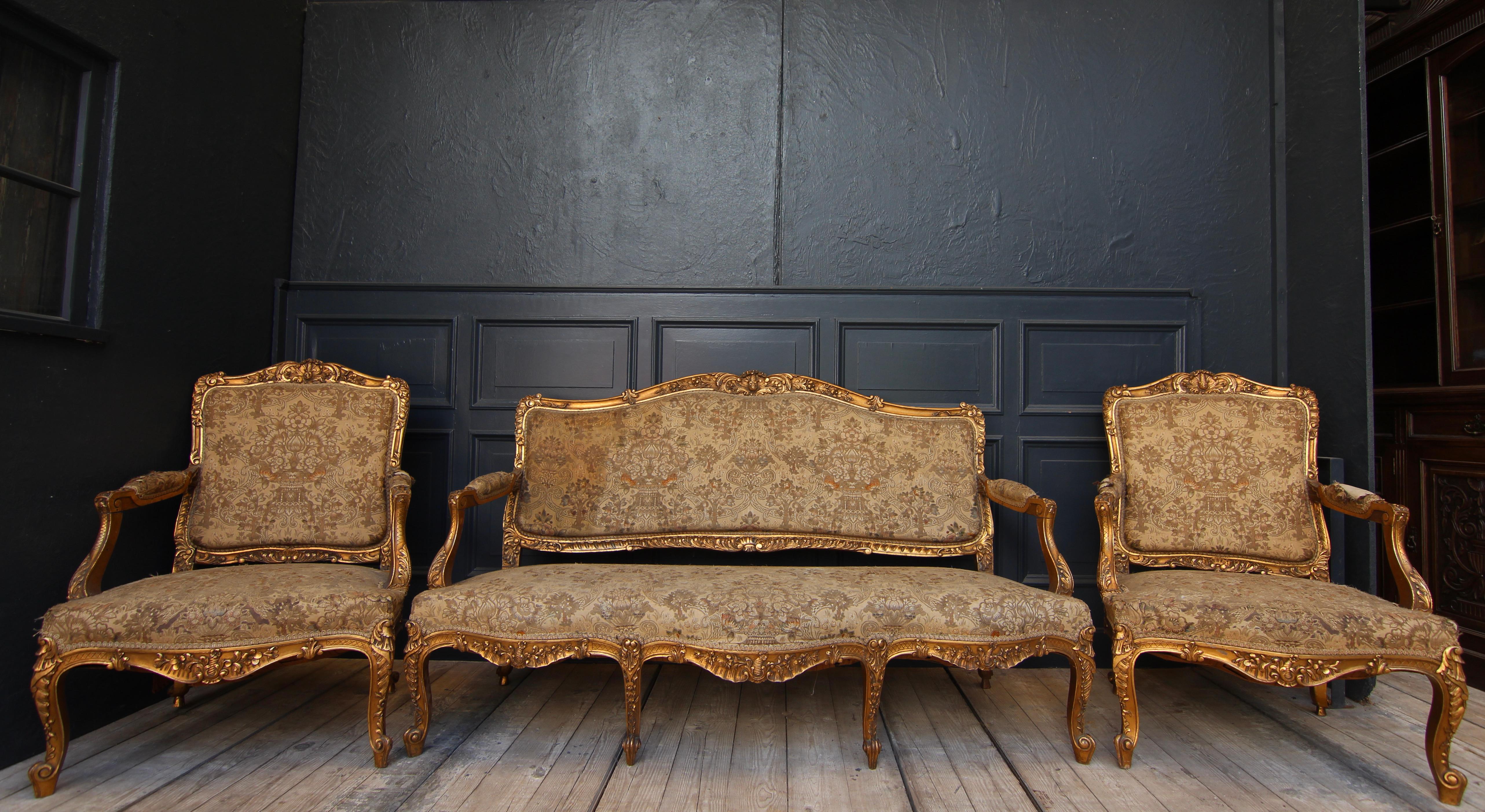 French salon group in Louis XV style. Around 1920. Unrestored original condition.

Three-piece set consisting of a sofa and 2 armchairs.

Original tapestry cover.

Dimensions:

Sofa: 
99 cm high / 39.1 inch high,
170 cm wide / 66.9 inch