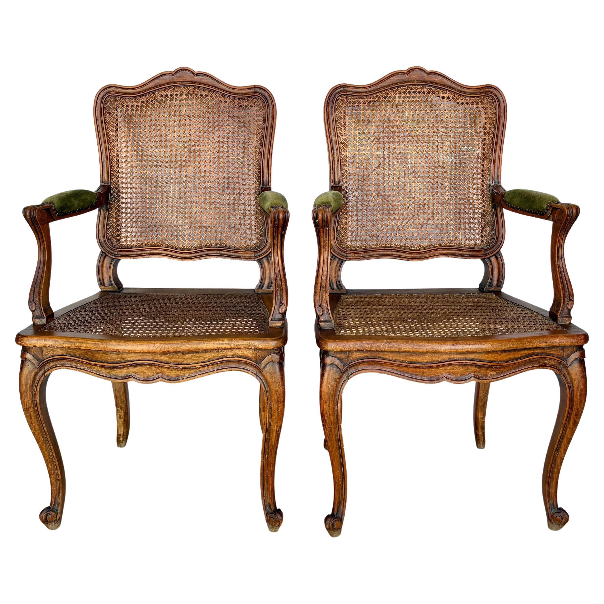 Early 20th Century French Louis XV Walnut and Caned Armchairs - a Pair