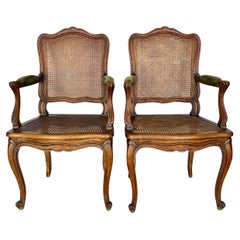 Early 20th Century French Louis XV Walnut and Caned Armchairs - a Pair