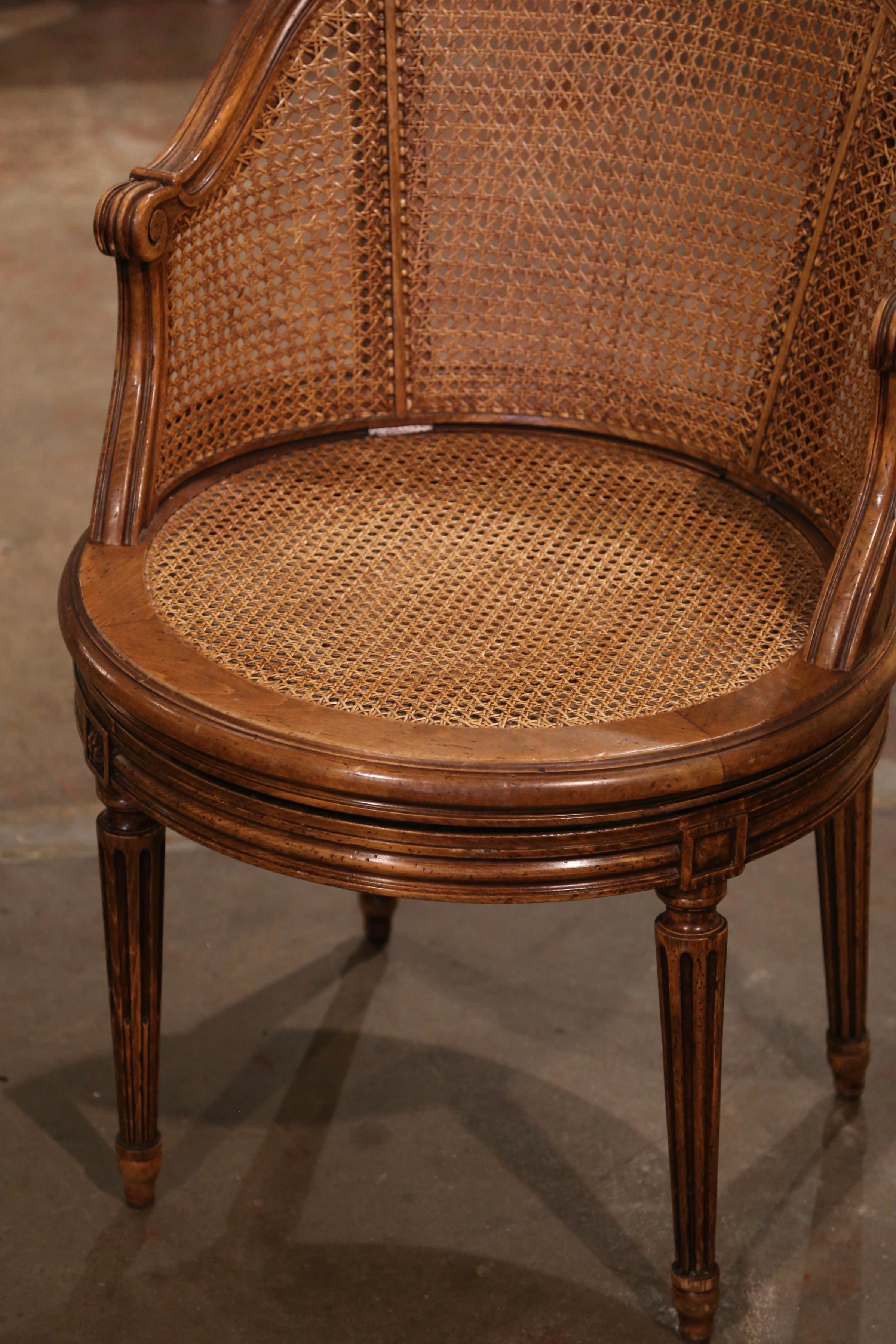 Hand-Carved Early 20th Century French Louis XVI Carved Walnut and Cane Swivel Desk Armchair