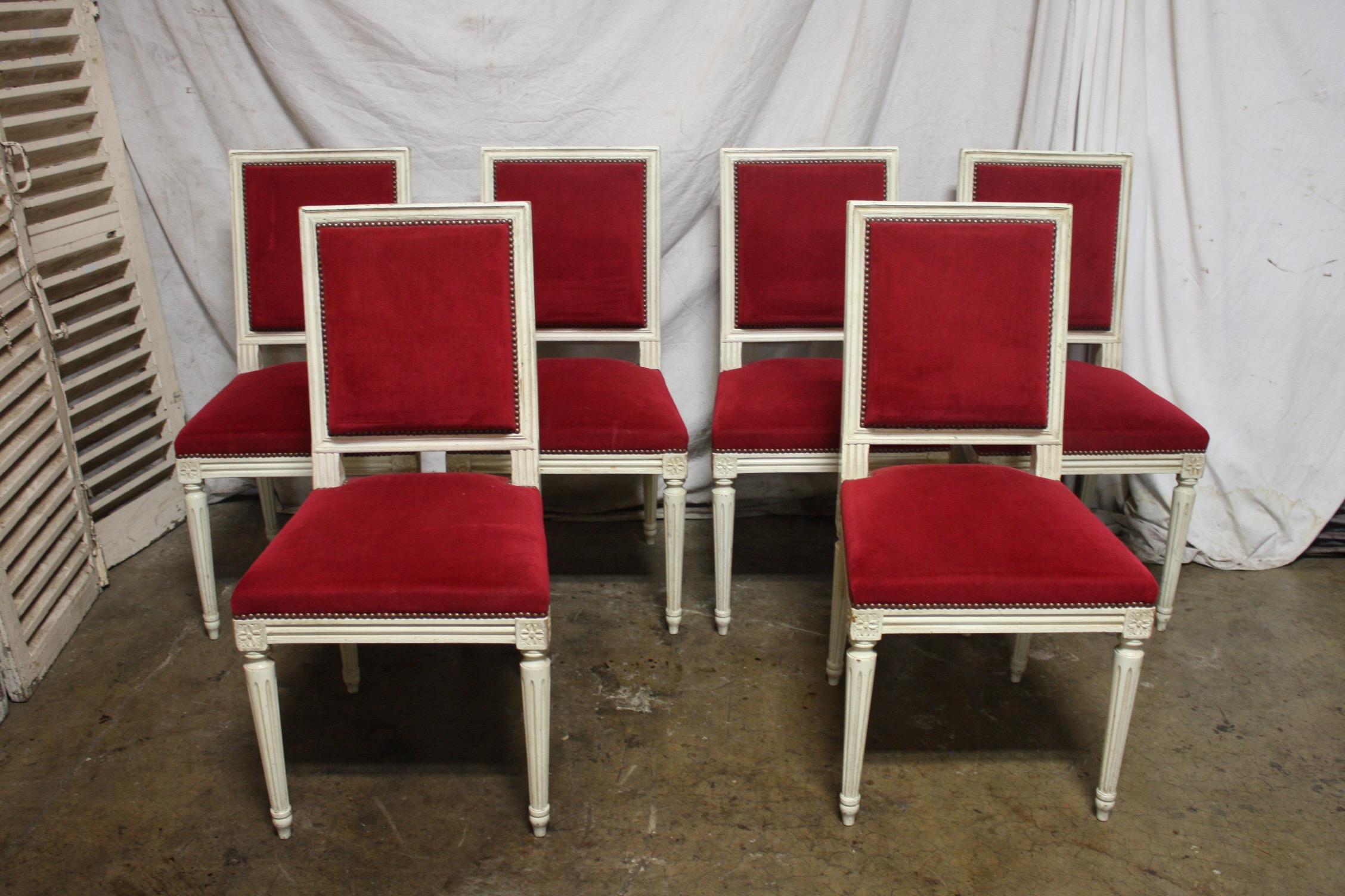 Early 20th century French Louis XVI dining room chairs.