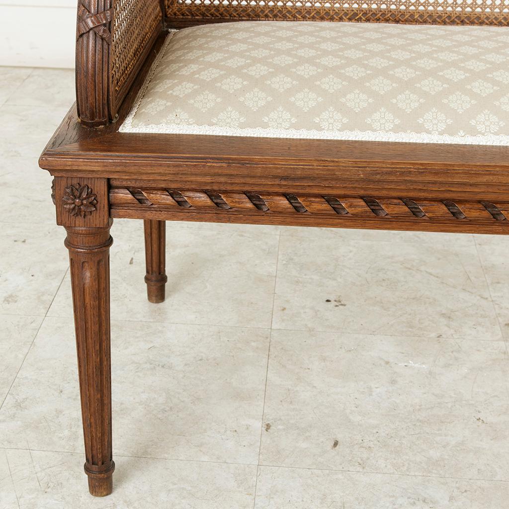 Early 20th Century French Louis XVI Style Carved Oak Banquette Bench with Caning 6