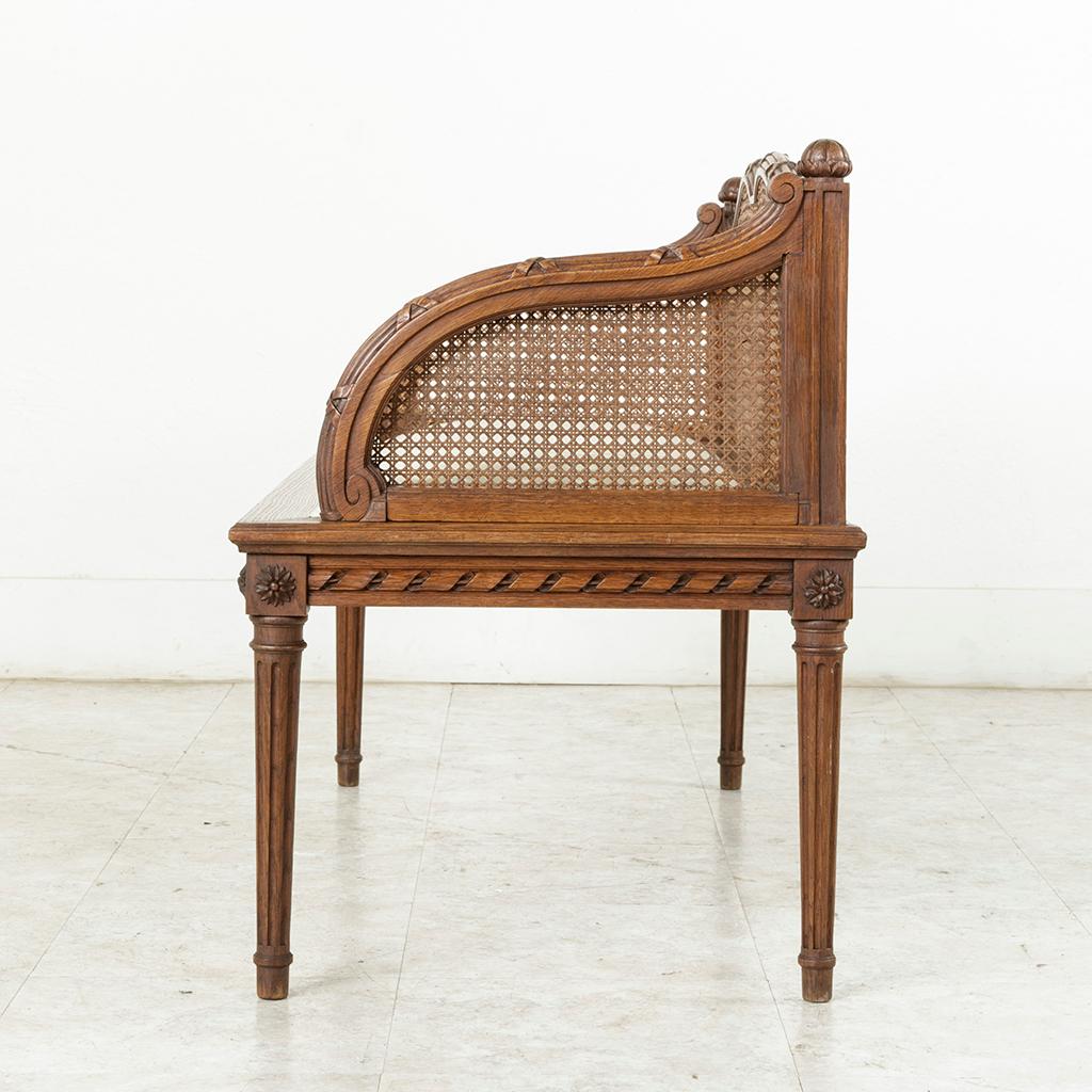 Early 20th Century French Louis XVI Style Carved Oak Banquette Bench with Caning 1