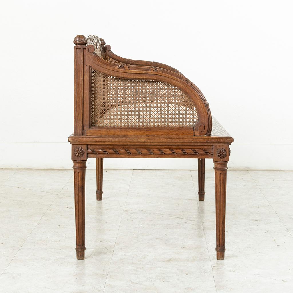Early 20th Century French Louis XVI Style Carved Oak Banquette Bench with Caning 3