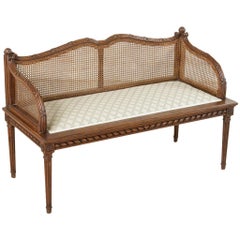 Antique Early 20th Century French Louis XVI Style Carved Oak Banquette Bench with Caning