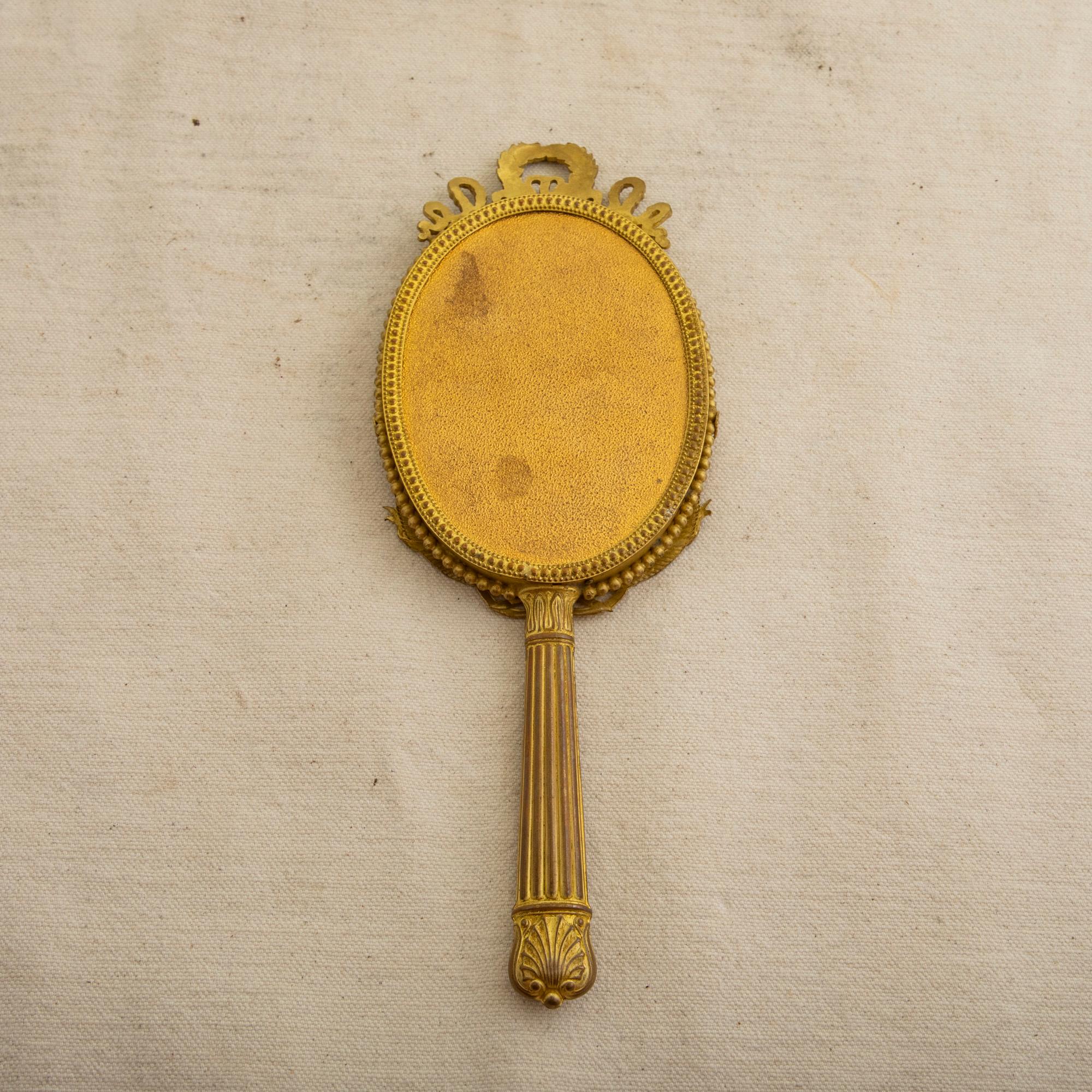 Beveled Early 20th Century French Louis XVI Style Gilt Bronze Hand Mirror