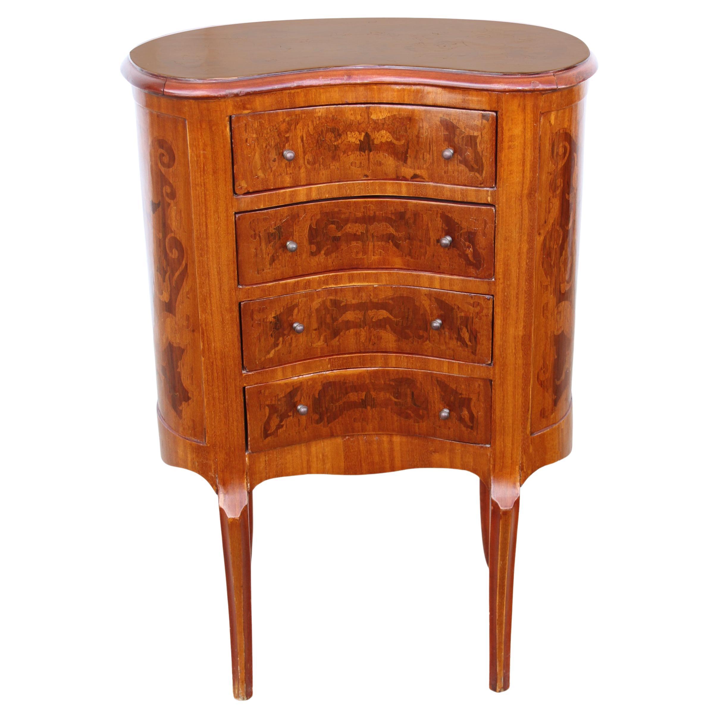 French Louis XVI Style Kidney Shaped Side Table 

Paul Sormani style Inlaid side table with beautiful hand laid floral designs. Four drawers.  Cabriole tapered legs. Circa 1920 and shaped as a kidney, the fruit wood 