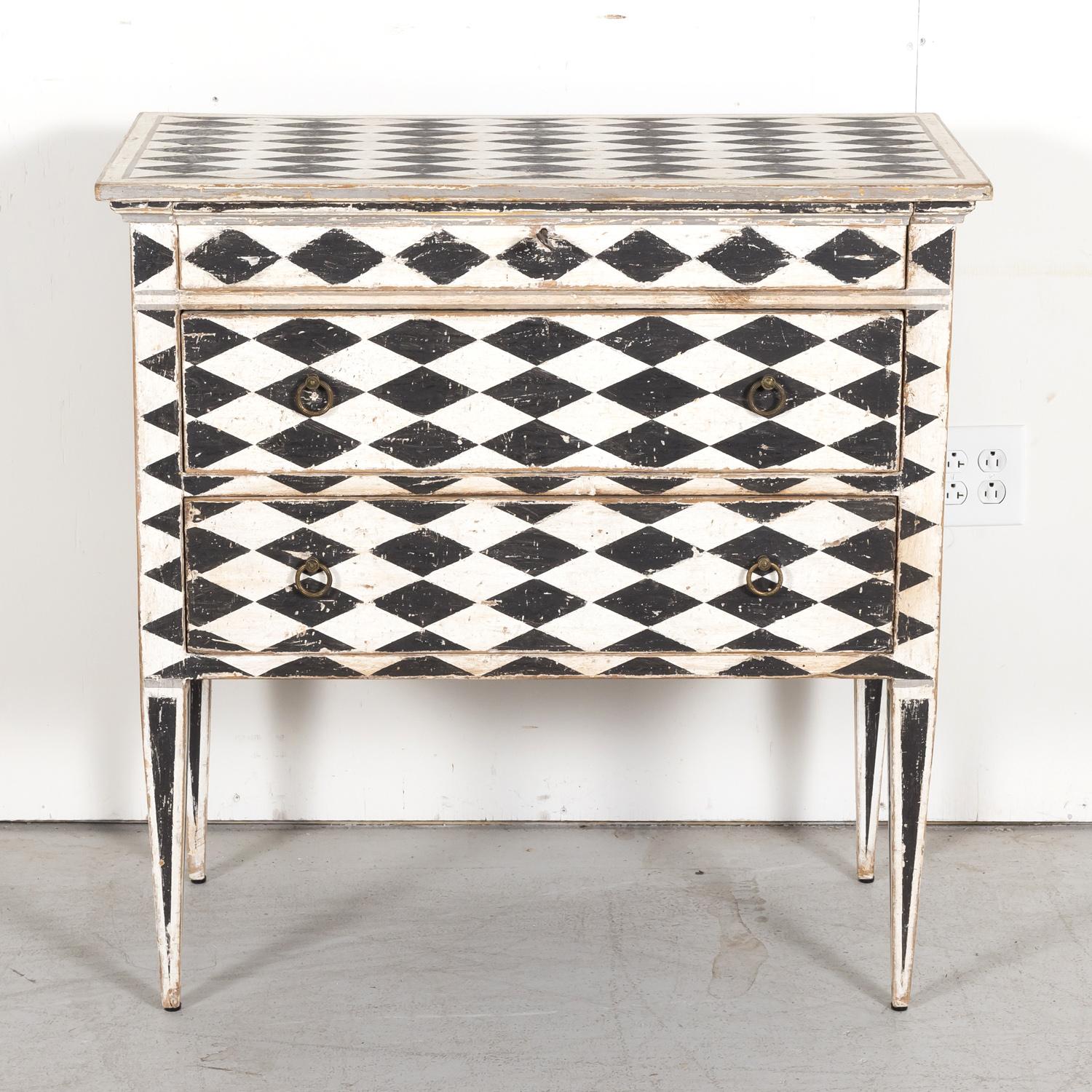 Early 20th century French Louis XVI style hand painted petite commode having a rectangular top over a single frieze drawer atop two full drawers adorned with original circular brass pulls, circa 1920s. Raised on straight tapered legs. This fabulous