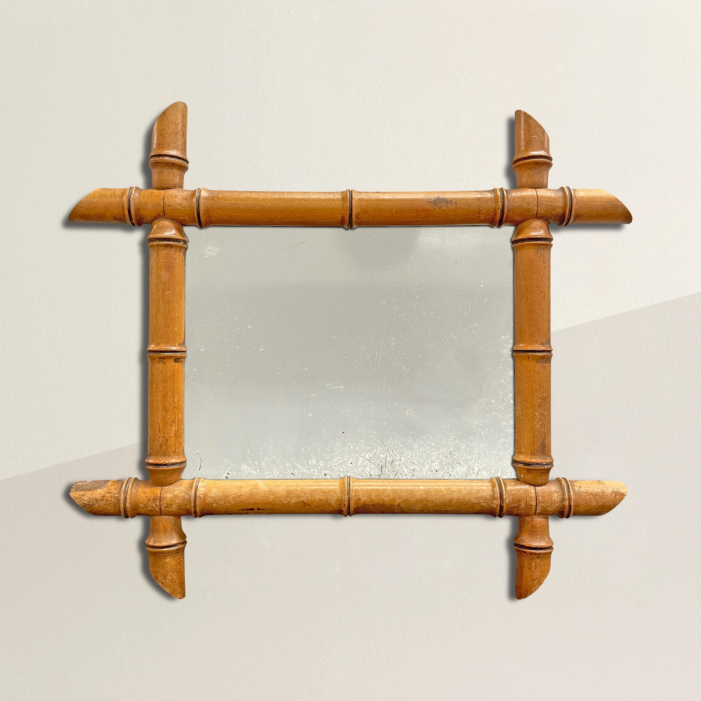 A charming early 20th century French maple framed mirror carved to mimic bamboo. The perfect mirror for a small bathroom, guest room, or anywhere you need a little sparkle.