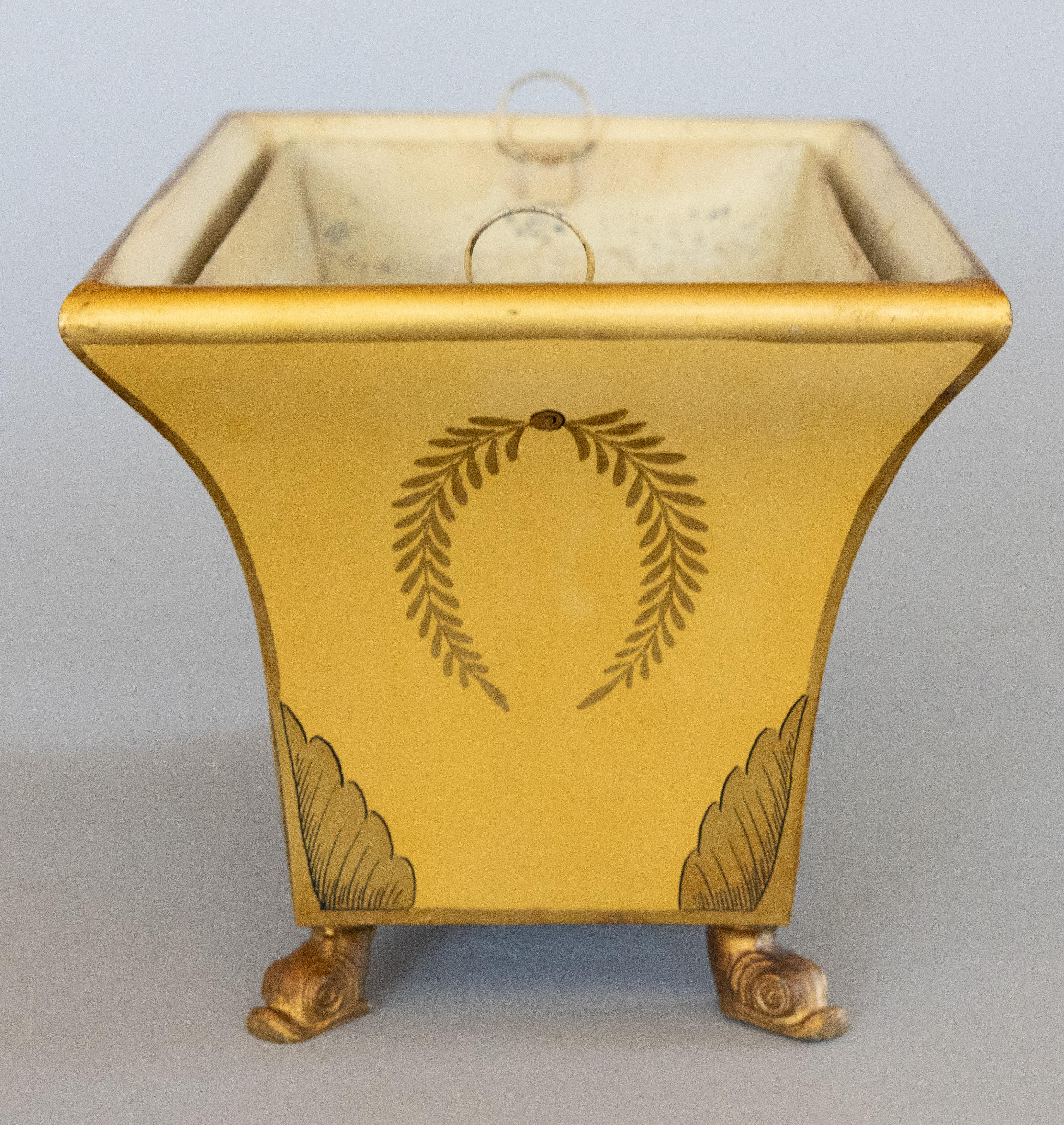A lovely antique early 20th-Century French mustard yellow tole footed jardiniere or cache pot with the original tin removeable liner. Signed 