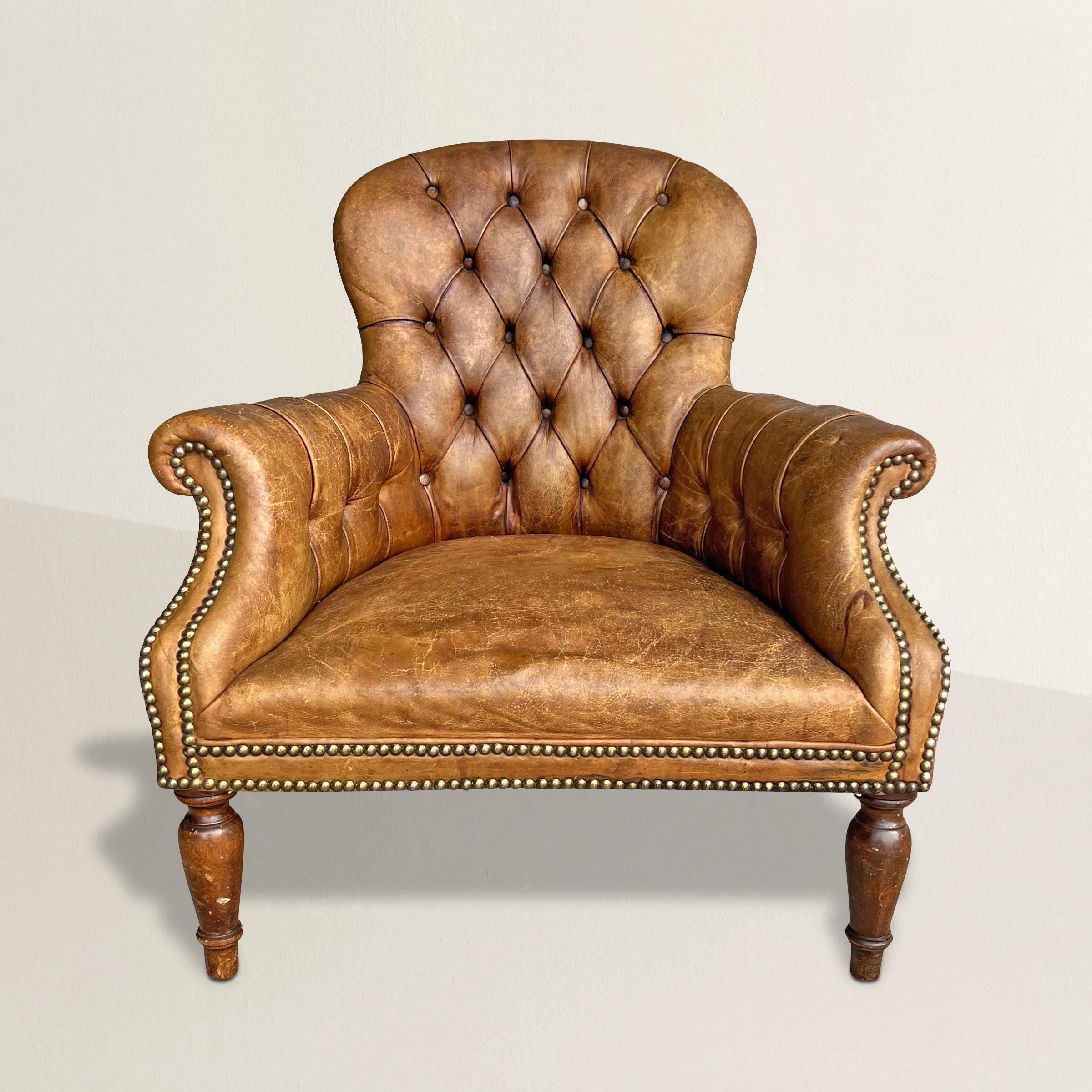Indulge in the timeless allure of the Napoleon III era with this exquisite 20th-century French tufted leather armchair, thoughtfully executed in the grandeur of the Second Empire style. Drawing inspiration from the period's penchant for eclecticism,