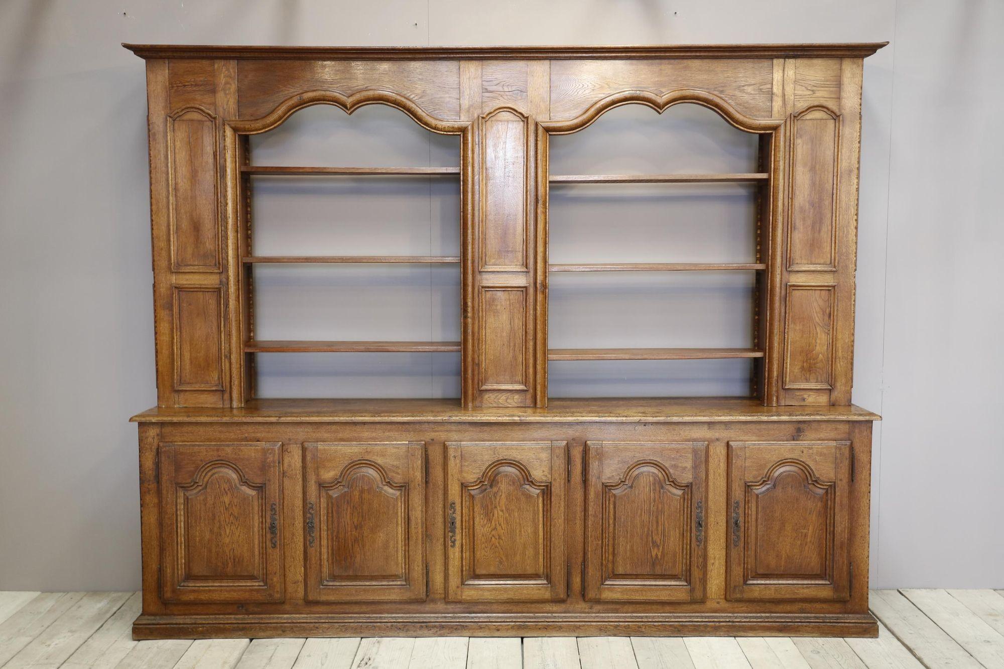 This is an absolutely gorgeous early 20th century solid oak French kitchen dresser. Great design with the moustache details around the open shelves and cupboard base. All doors of cupboards have working locks and the shelves are full adjustable.