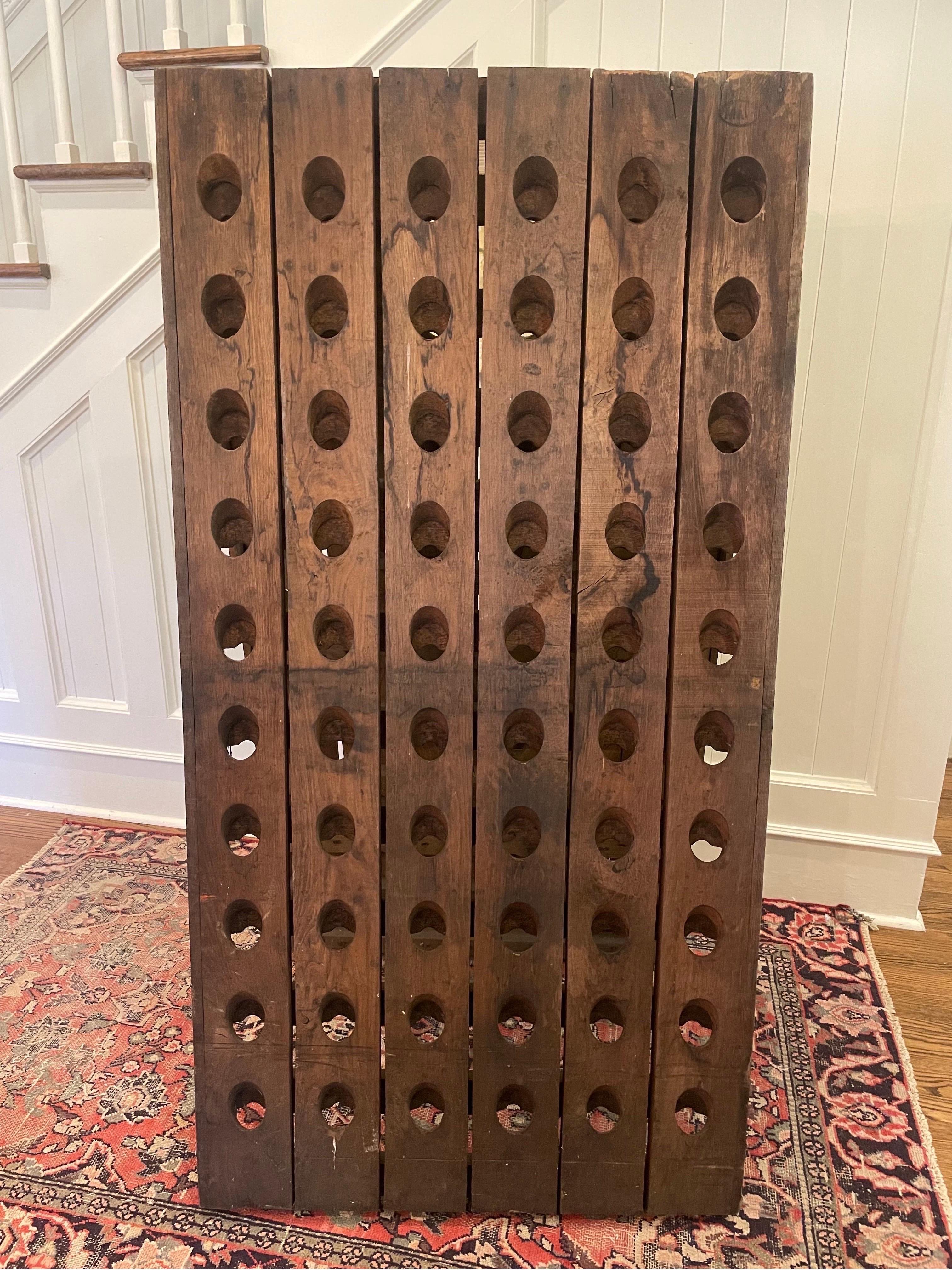 Antique standing riddling rack from France. These were designed to store wine bottles in. Each side of the rack as 60 holes. Our Vintage A frame French Riddling Rack is from the early 20th century. Use for storage of unopened bottles or keep the