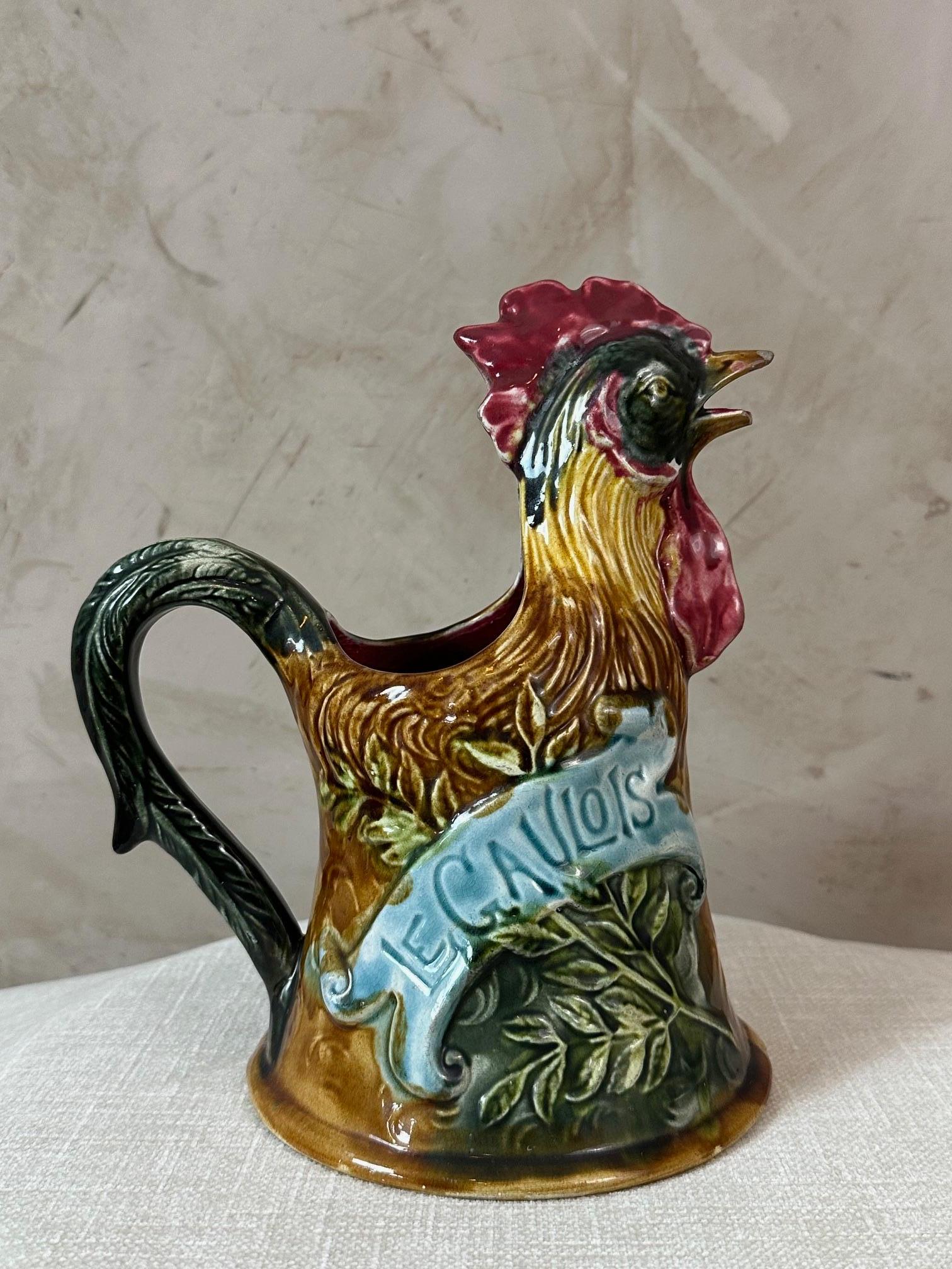 A lovely pitcher from the Onnaing faience factory dating from the early 20th century representing a rooster. The spout is slightly damaged. 
These pitchers were used by children to collect for war veterans. 
These roosters are rarely found with