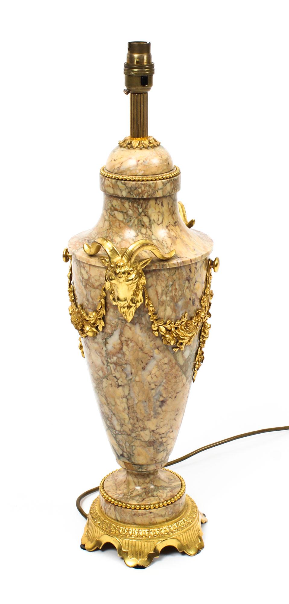 A beautiful French ormolu-mounted table lamp, circa 1920 in date.

This beautiful ormolu-mounted mable table lamp is decorated with superb ormolu floral garlands with ram's head mounts.

This was originally an urn that has been skillfully