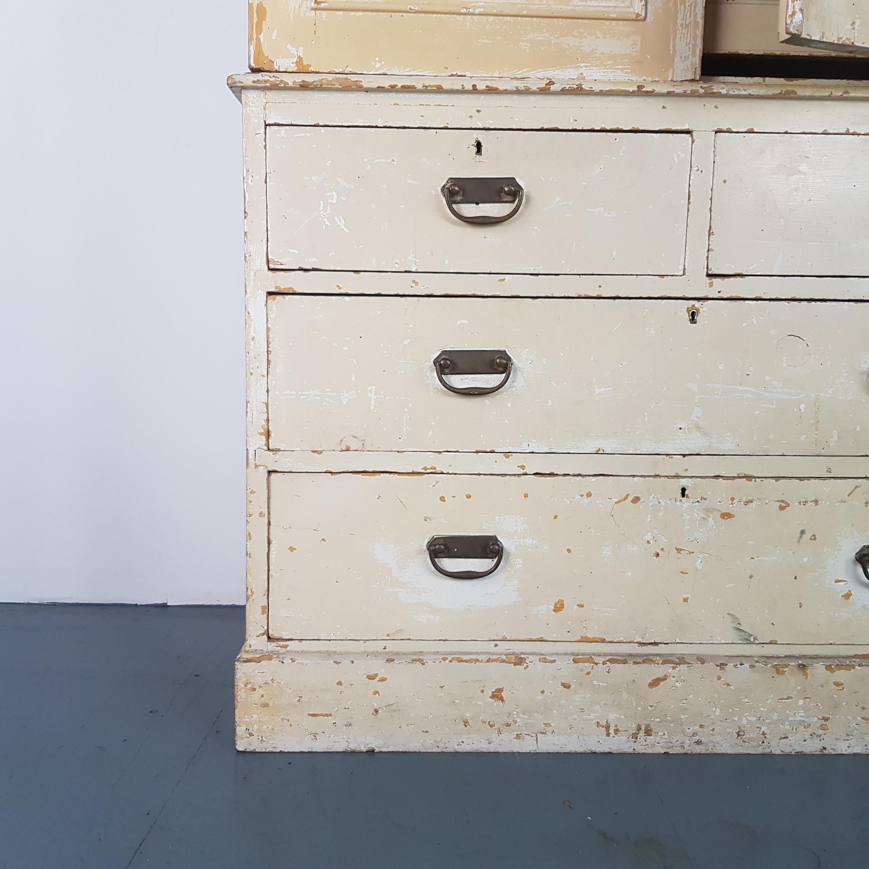 Lovely example of an early 20th century French solid pine linen cupboard.

Off white beautifully distressed original paintwork. The finish is rustic, but the piece is in good vintage condition.

Approximate dimensions:

Height 209cm

Width