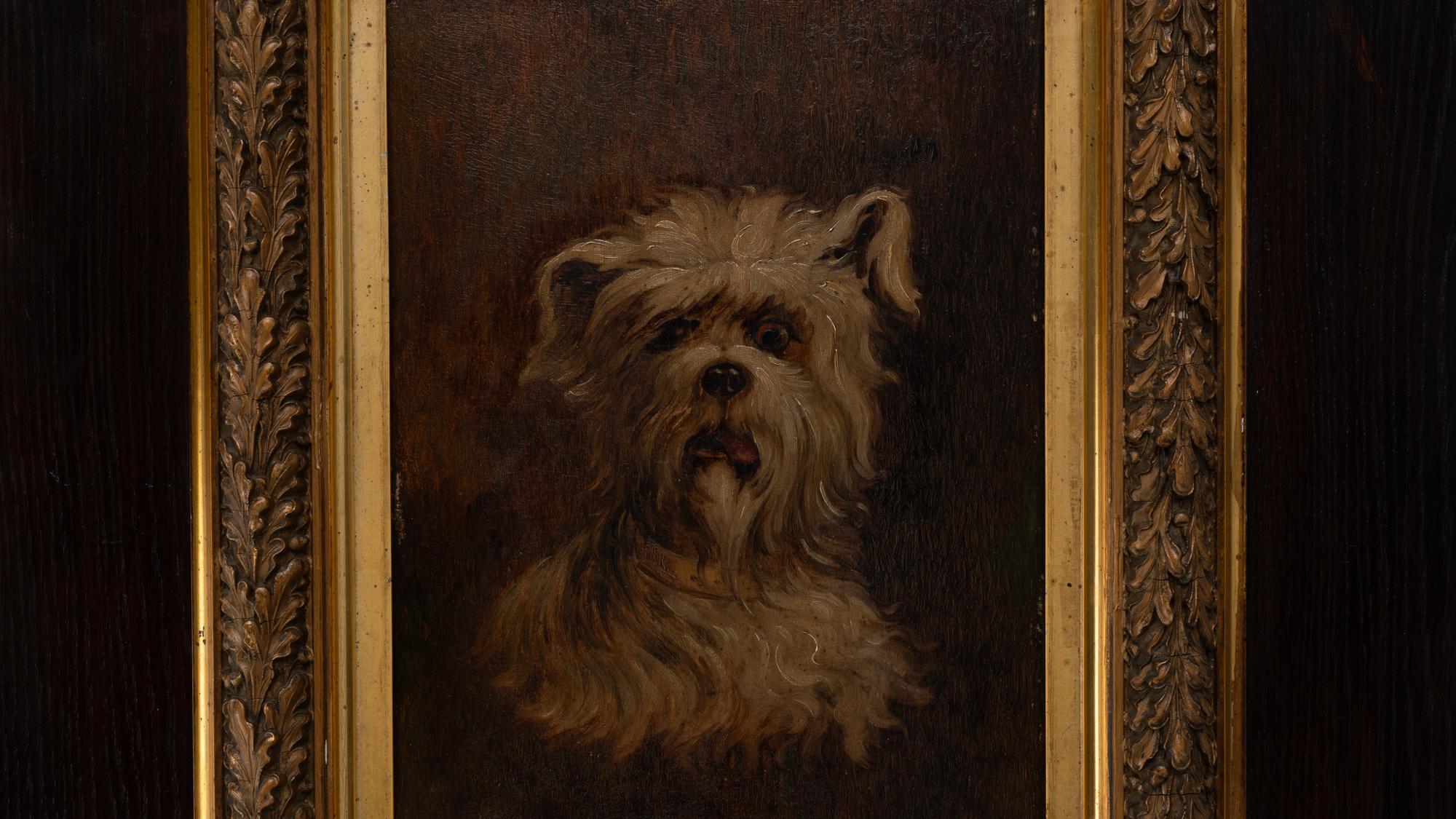 Capture the essence of vintage French artistry with this Early 20th Century French Painting, a charming portrayal of a beloved canine. This piece is ensconced within a rich, dark wooden frame that contrasts the golden hues of the intricate inner