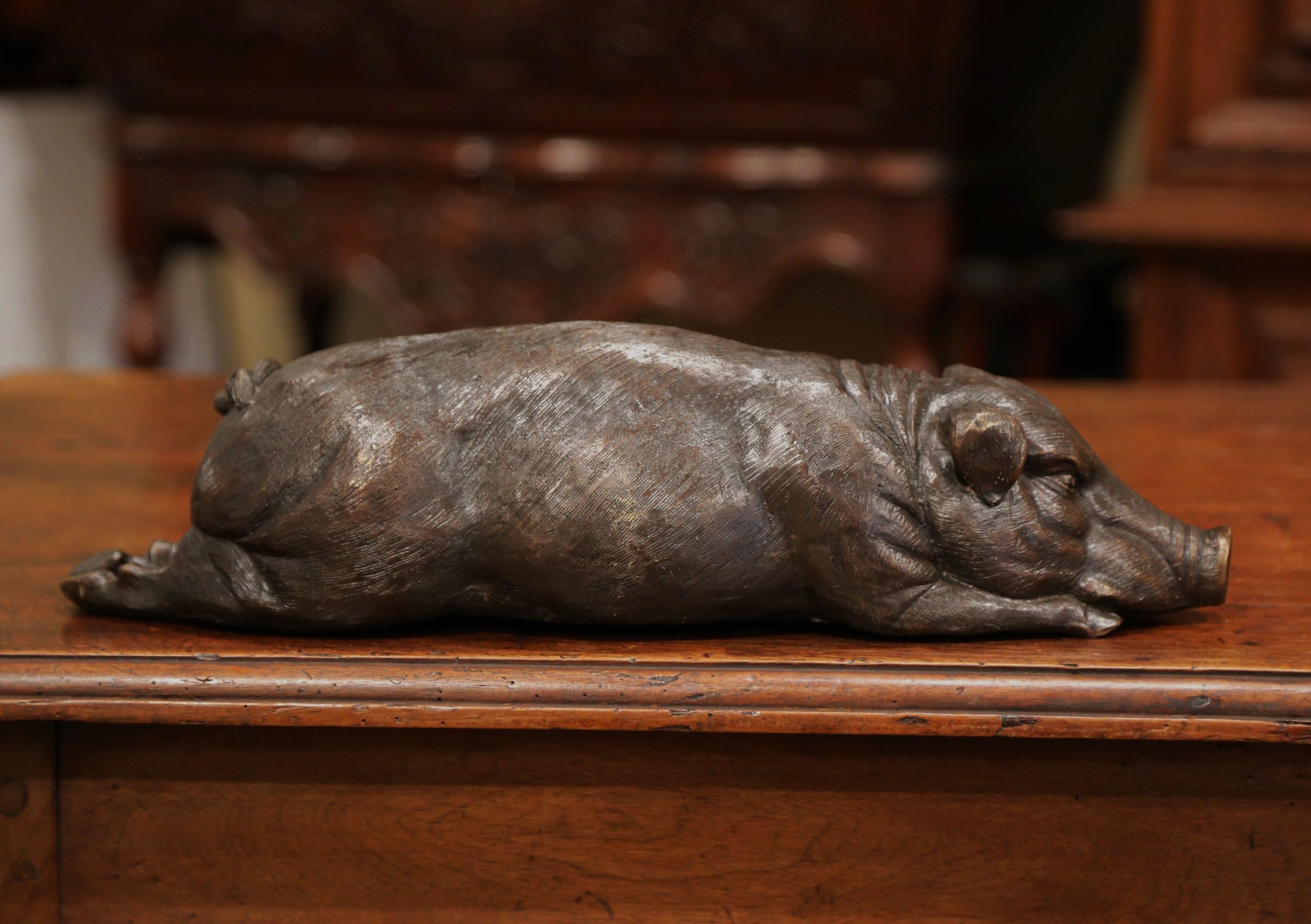 Crafted in France, circa 1920 and made of bronze, the large pig sculpture is shown taking a nap. The fun loving sculpture features wonderful details and is in excellent condition with a rich patinated finish. Place this sculpture on a kitchen
