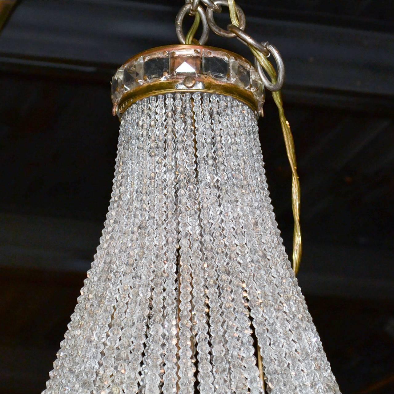 French bronze and crystal basket chandelier, circa 1910.
Made in France.
Measures: 27 inches height x 14 inches wide.