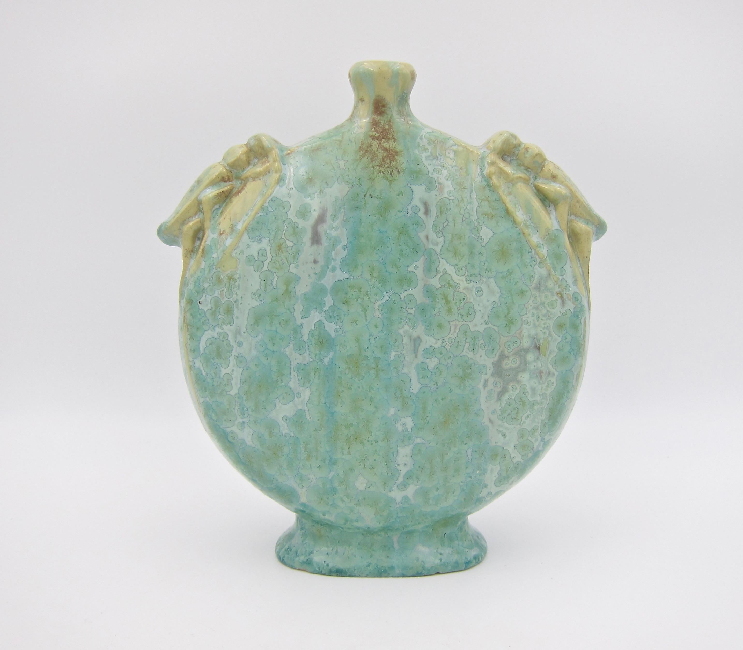 A superb turn of the 20th century art pottery vase from Pierrefonds Pottery of France, dating circa 1905. The antique stoneware vessel features Art Nouveau style cicadas perched on top of either shoulder and a sophisticated green crystalline glaze