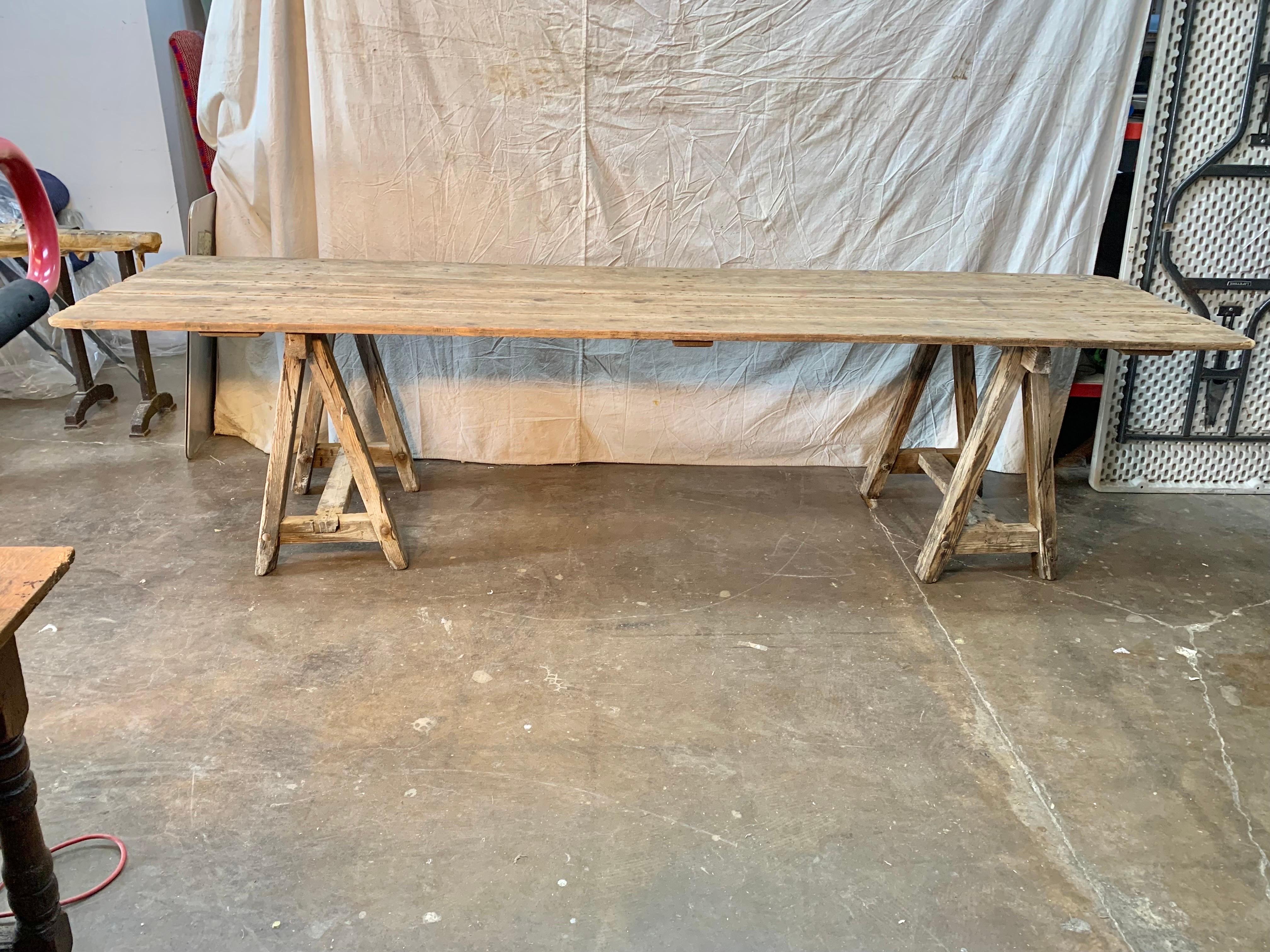 Found in the Burgundy region of France this Early 20th Century French Pine Vineyard Harvest Table is perfect for indoor or outdoor use. Monumental in size the table is just shy of 10 feet in length and has a weathered finish with a beautiful rustic