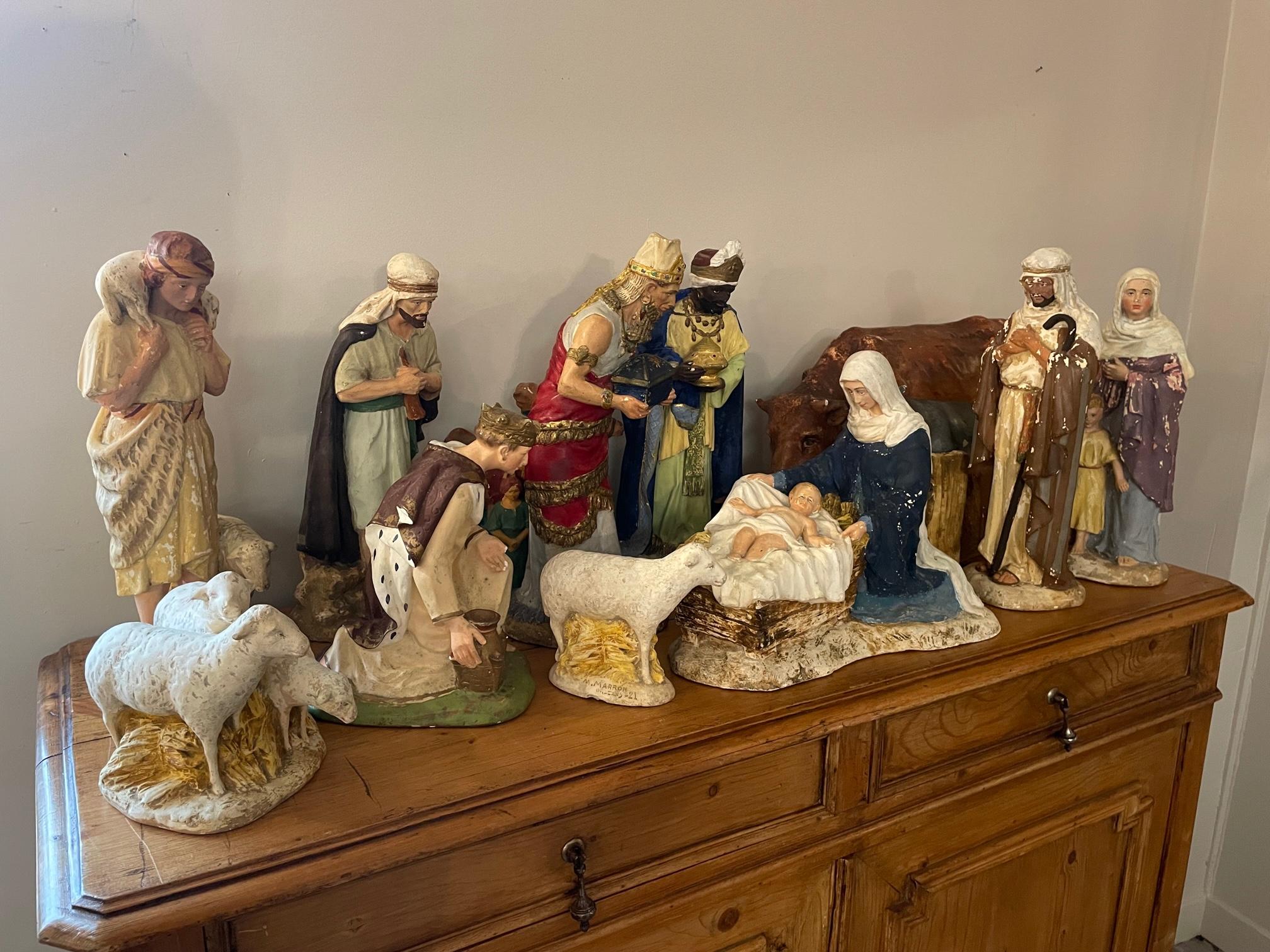 Very nice and rare 20th century French set of plaster nativity scene figurines. 
Twelve pieces are representing the religious nativity characters and the animals. 
Large dimensions. Show some minor losses and the paint is fading but good general