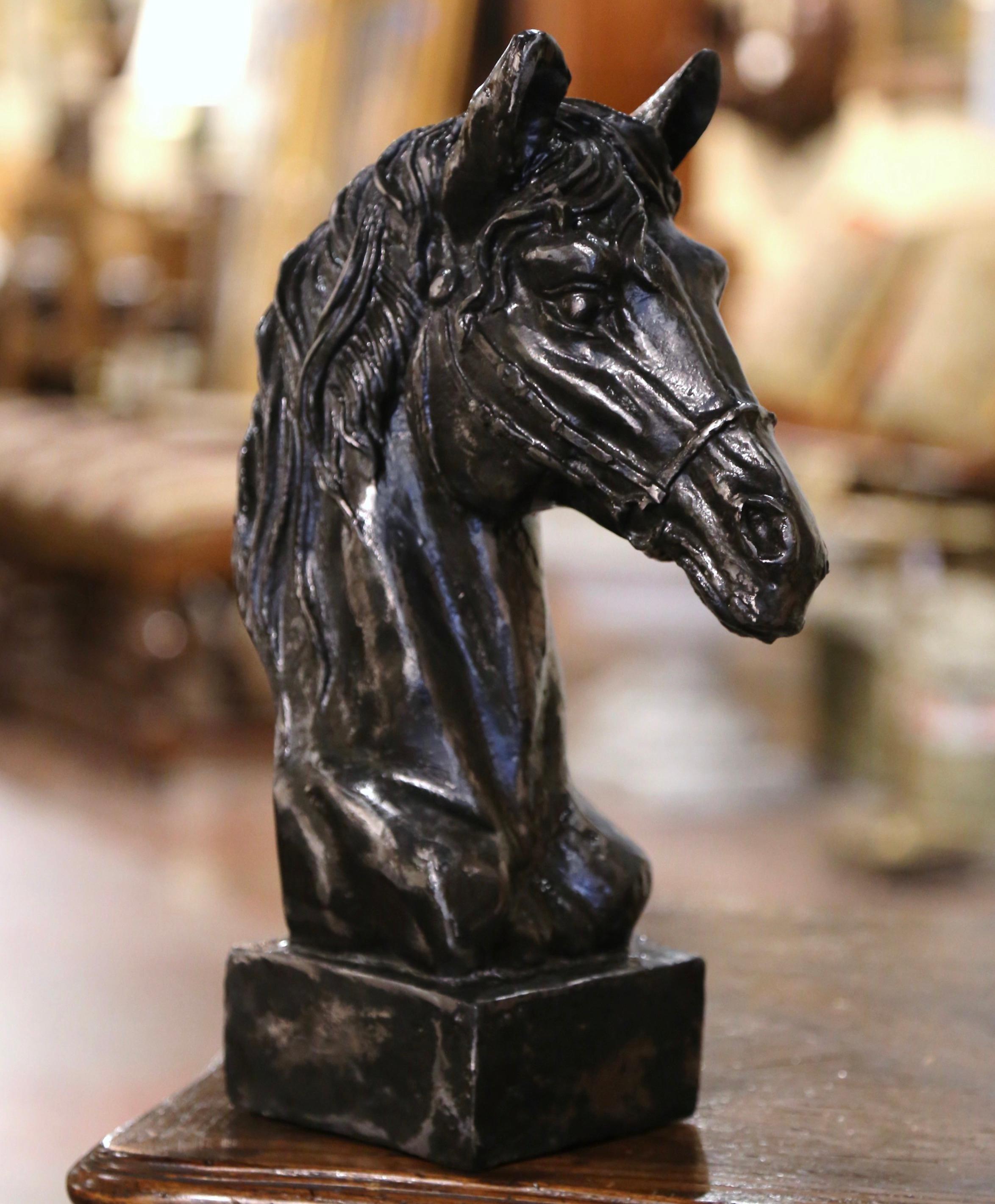 Decorate a study or office with this elegant antique sculpture. Crafted in France circa 1930, the piece depicts a horse head figure resting on integral square base. The tall decorative sculpture is in excellent condition and adorns a rich polished