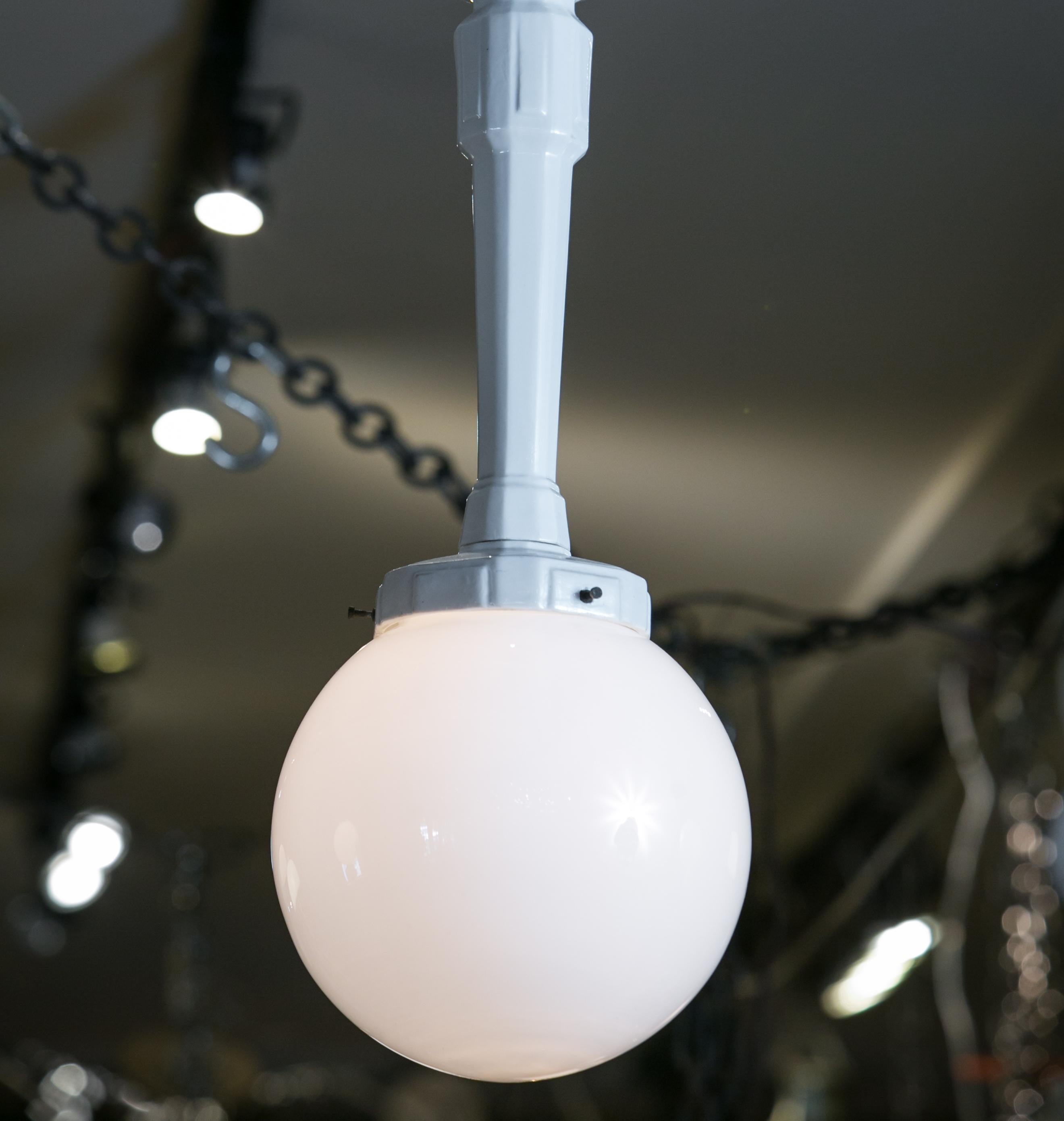 The stem of the pendant is made from cast porcelain and the globe is old milk glass. The pendant has been wired in the USA with a custom canopy so that it is ready to install. I very seldom run across the style of pendant. I think that it would look