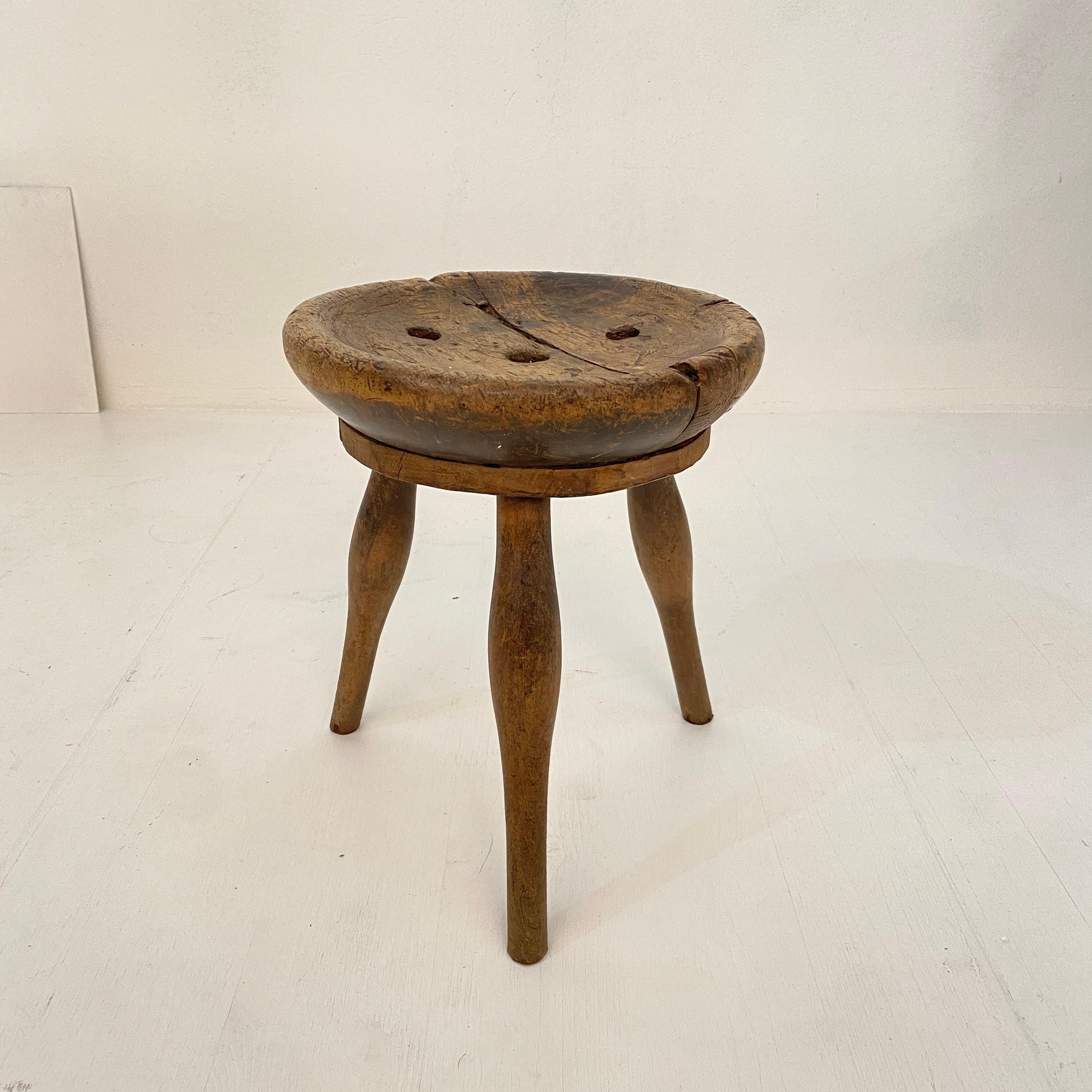 This cobbler splayed leg wood stool was made circa 1900 in France.
The seat is carved out of a solid piece of ash and the 3 legs are made out of beech.
And it has this fabulous Wabi Sabi look and beautiful Patina.
It is in its original condition.
A