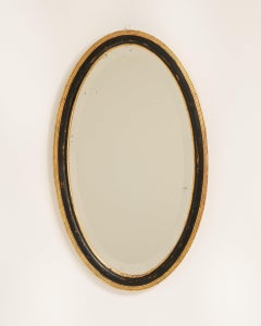 Early 20th Century French Provincial Oval Mirror, Black Giltwood Frame