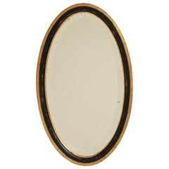 Early 20th Century French Provincial Oval Mirror, Black Giltwood Frame