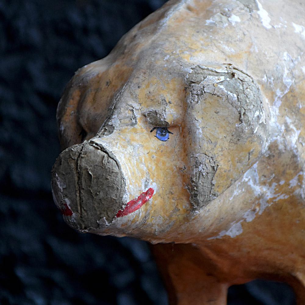 Early 20th century French pull along papier mâché toy pig.
A highly decorative example of an early 20th century papier mâché pull along toy pig. Larger than the normal examples this item has had lots of hours of play time, a rare survivor even in