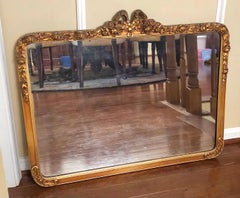 Early 20th Century French Ribbon Bow and Roses Giltwood Ornate Frame Wall Mirror