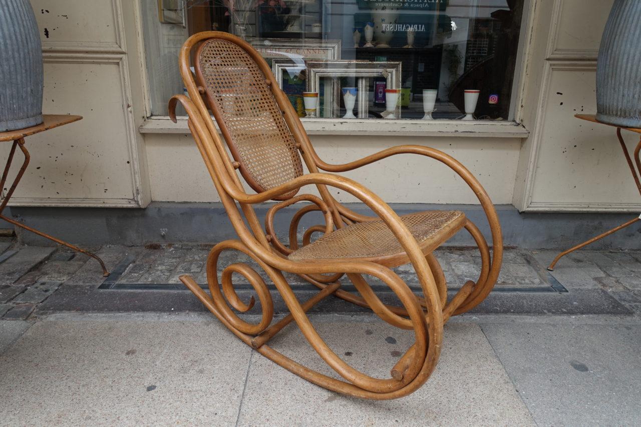 Charming Thonet inspired rocking chair, from the early 20th century. Shaped and steam bent beech tree frame, with a woven back and seat. Elegantly made with quality carpentry skills. An artwork in itself.