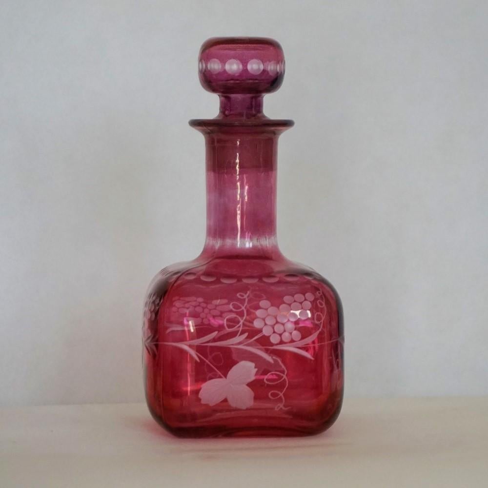 Beautiful ruby to engraved clear cut glass bottle with stopper or decanter, France, 1900-1910.
Measures: Height 9.75 in (25 cm)
Width 4.50 in (11.5 cm)
Depth 4.50 in (11.5 cm).