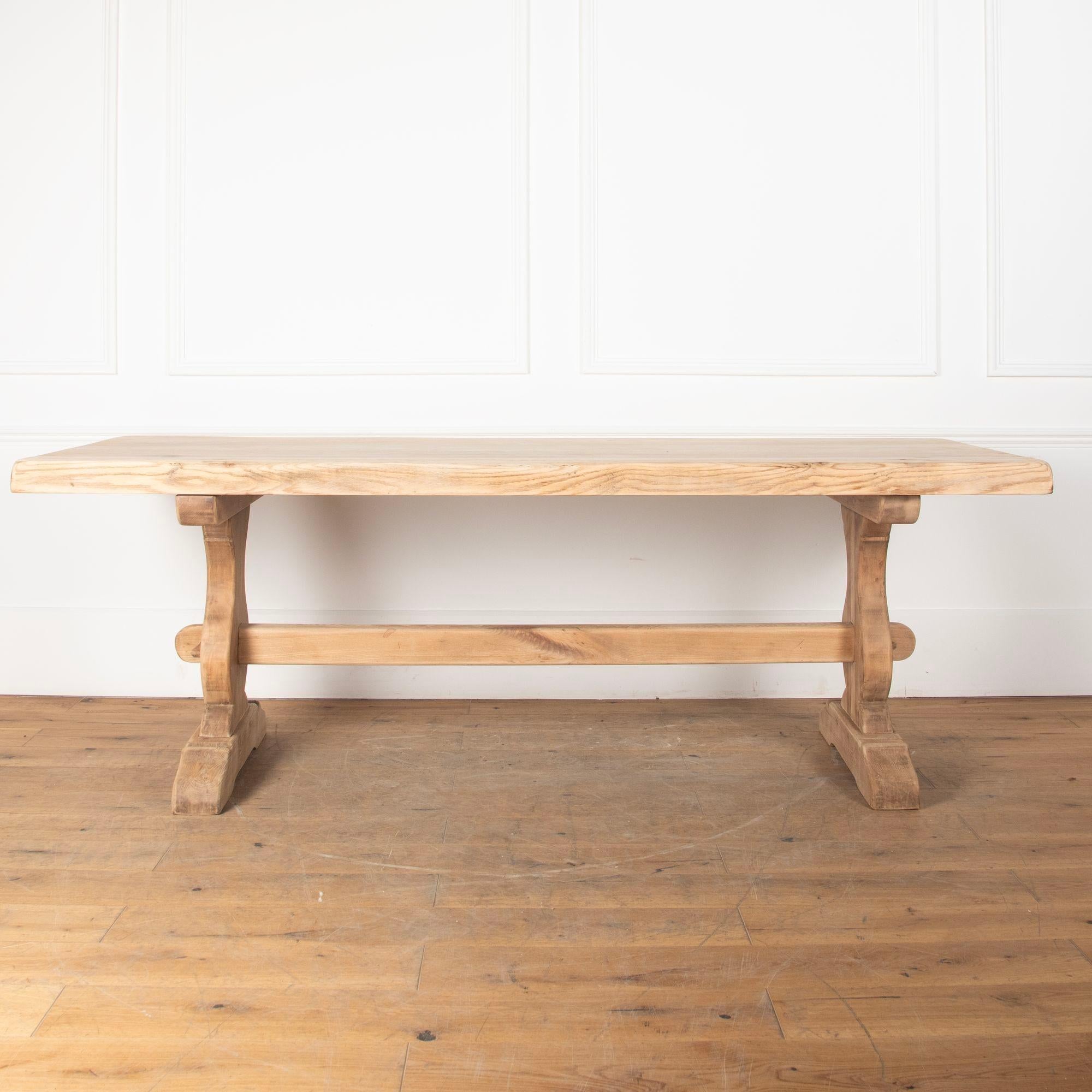 Great early 20th Century scrubbed oak dining table.This piece has been scrubbed to give it a more contemporary feel and will seat 6/8 people.Comes apart for ease of transportation/delivery.France, circa 1930s.