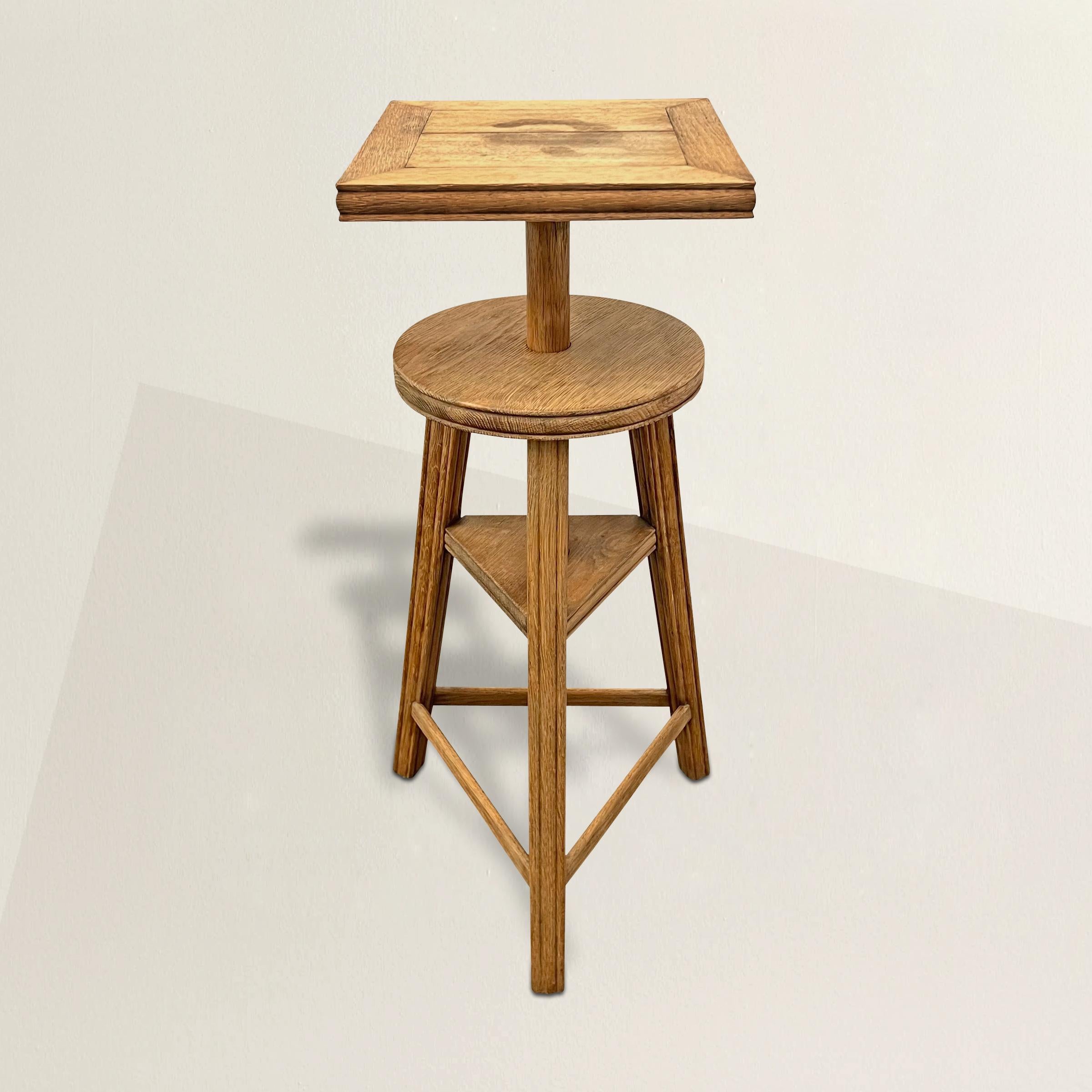 A chic early 20th center French oak Sculptor's stand with a top that spins and adjusts from 27 inches to 33 inches in height.  A simple oak pin holds the top in place.  Perfect for displaying your favorite vase or objet d'art.  