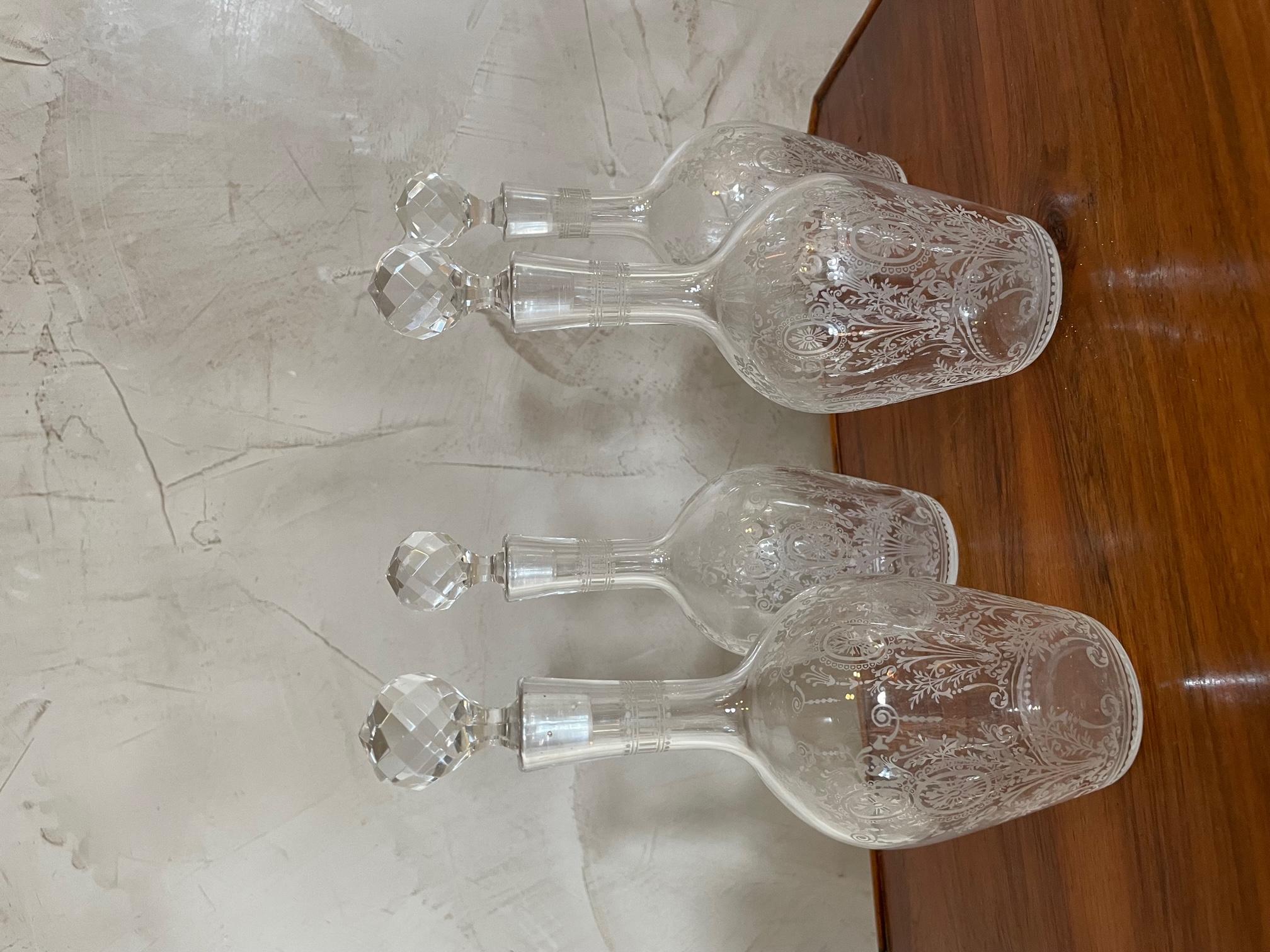 20th century French set of four crystal carafe from the 1900s. 
Beautiful engraved details. Every carafe has a plug like a diamond. 
Very good condition. 