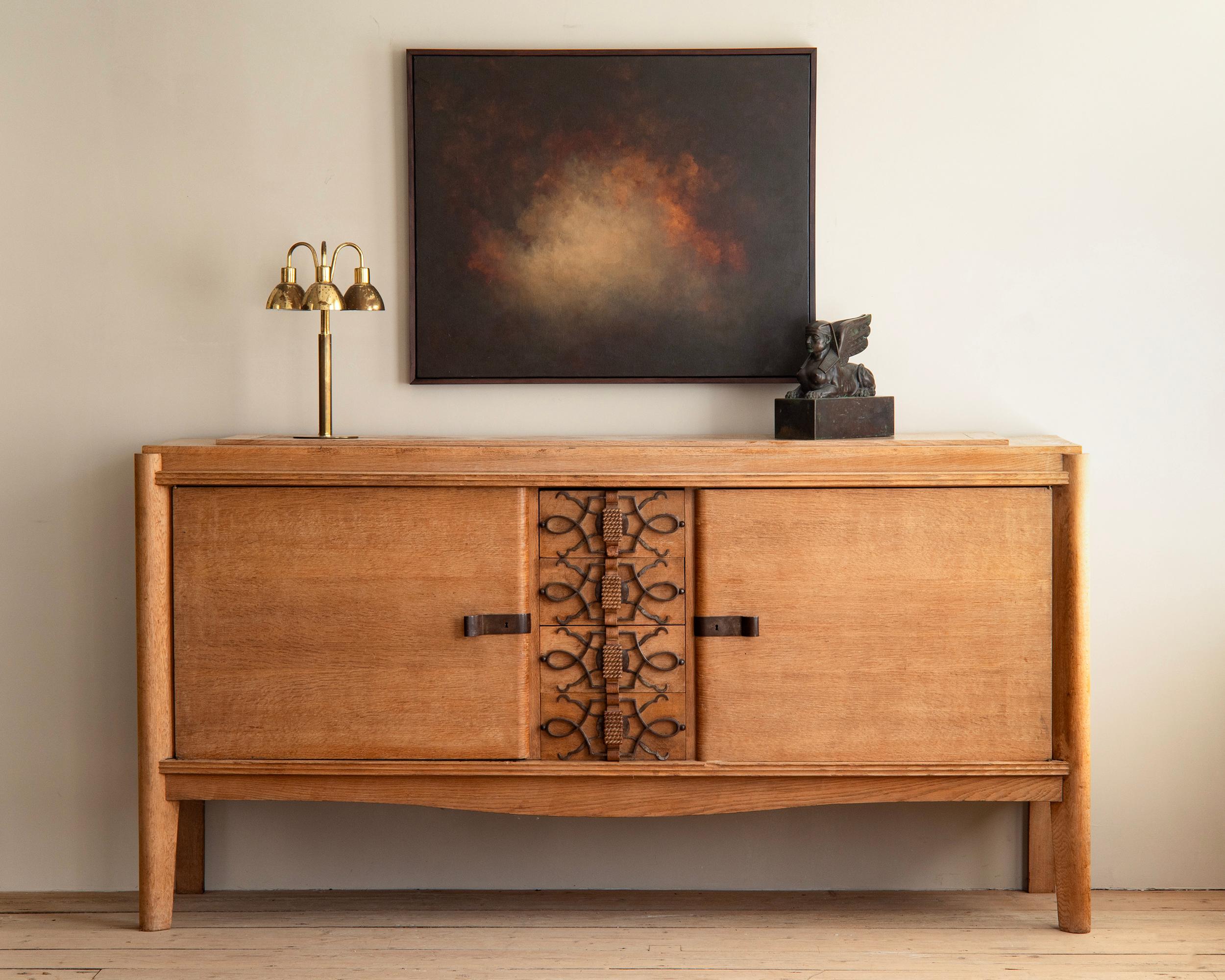 Large early 20th century French Modern solid oak and iron sideboard. ca 1930s, France. 