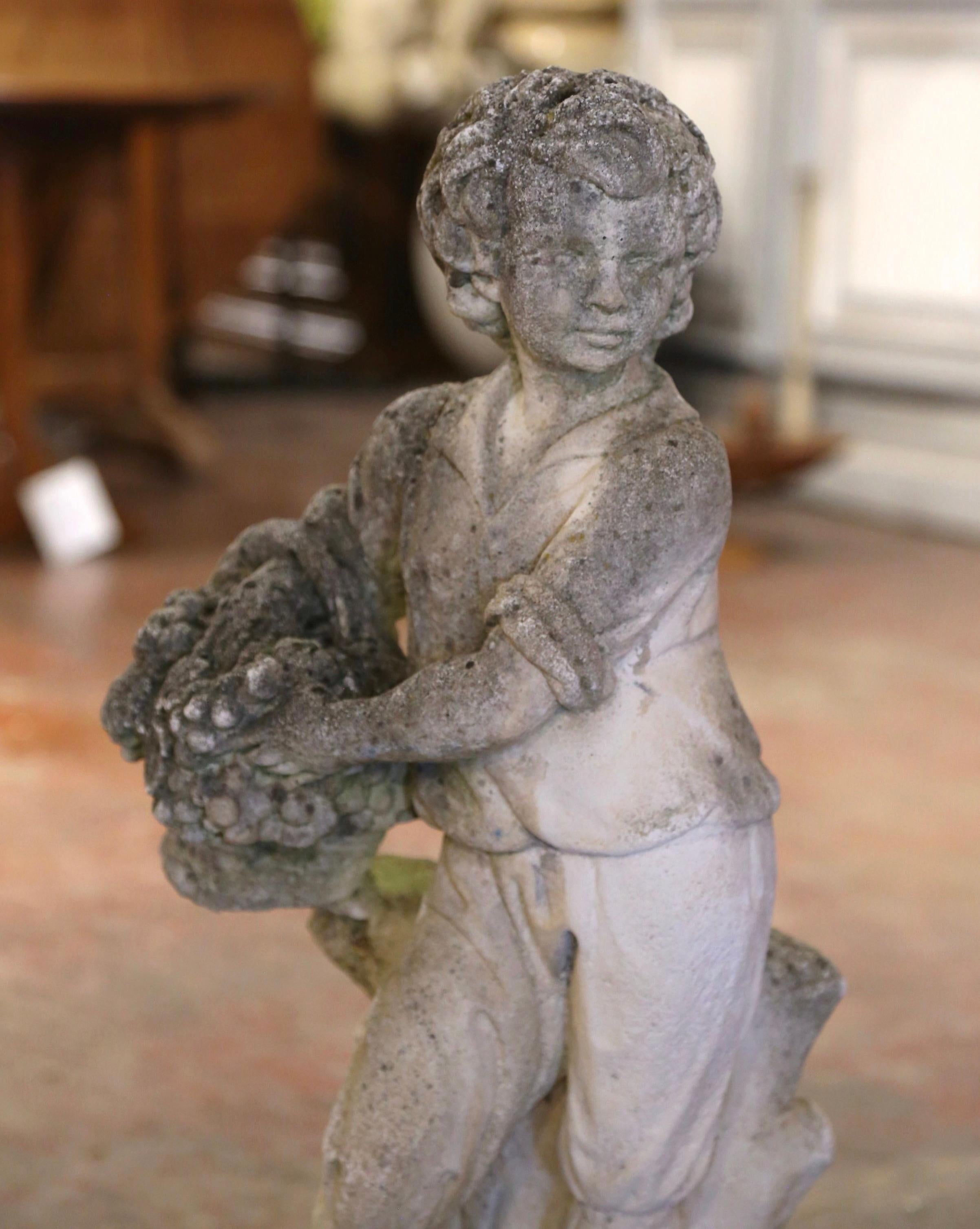 Neoclassical Early 20th Century French Stone Garden Statue of Young Boy Holding Grapes For Sale