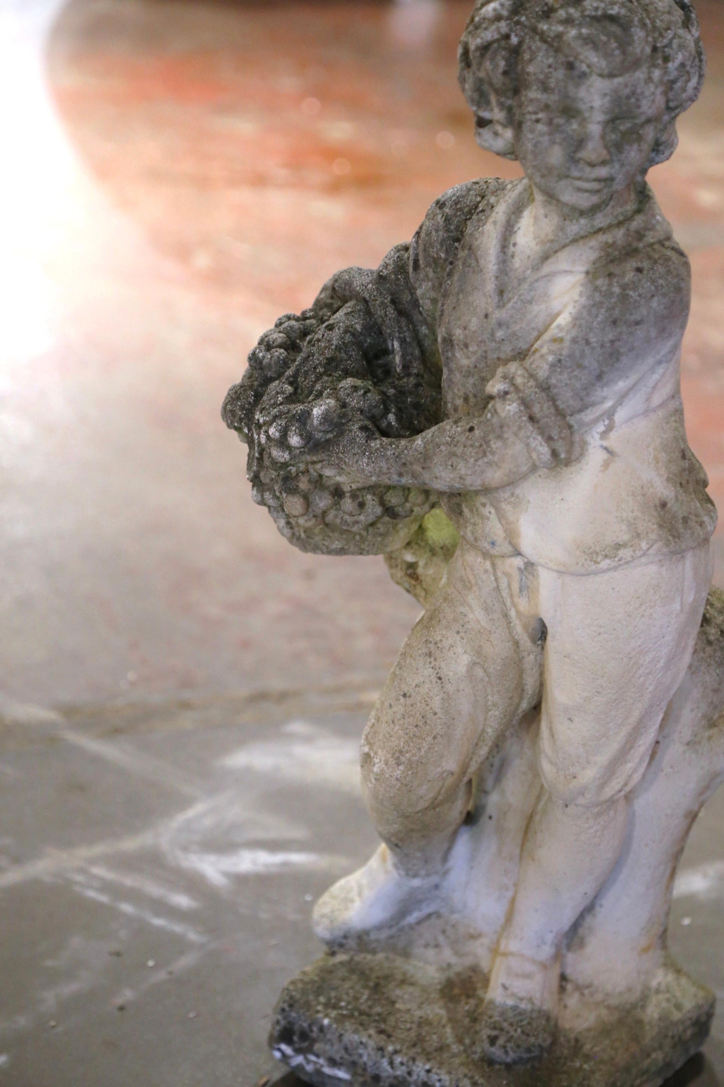 Hand-Carved Early 20th Century French Stone Garden Statue of Young Boy Holding Grapes For Sale