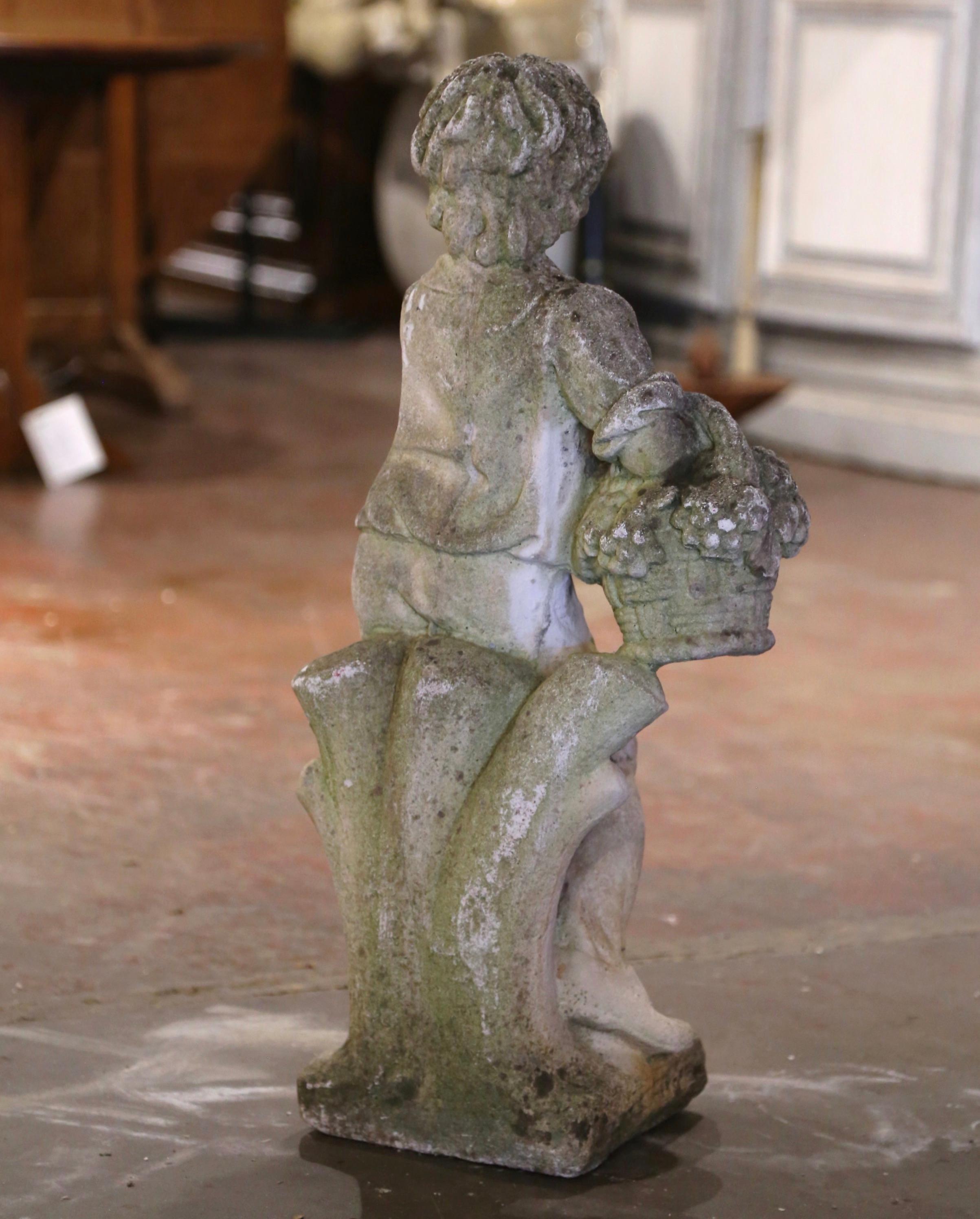 Early 20th Century French Stone Garden Statue of Young Boy Holding Grapes For Sale 1