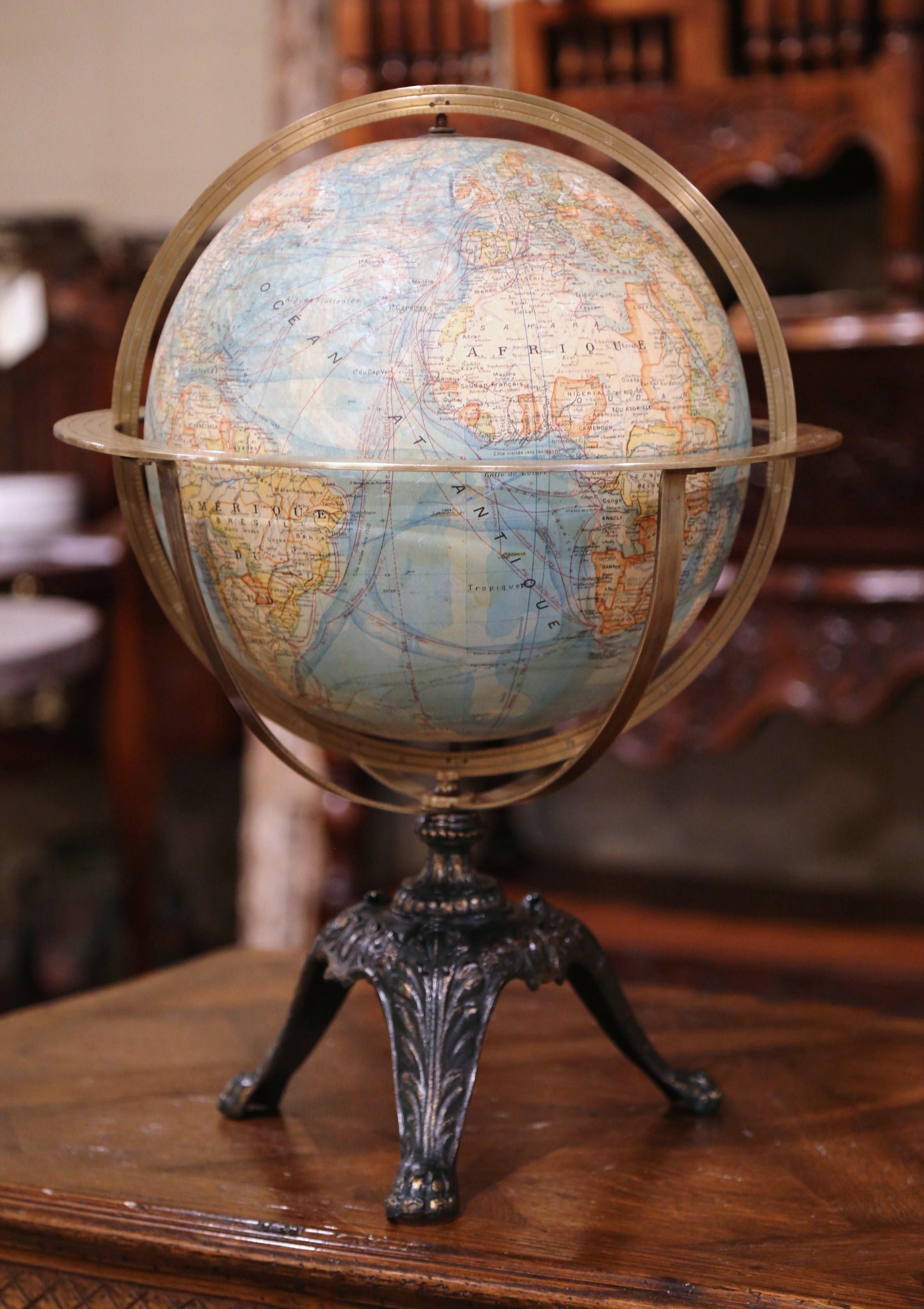Decorate an office with this spectacular antique globe. Crafted in France, circa 1920 (it shows Constantinople not Istanbul; the city changed its name in 1930), the terrestrial piece sits on a pedestal base with three legs with paw feet and
