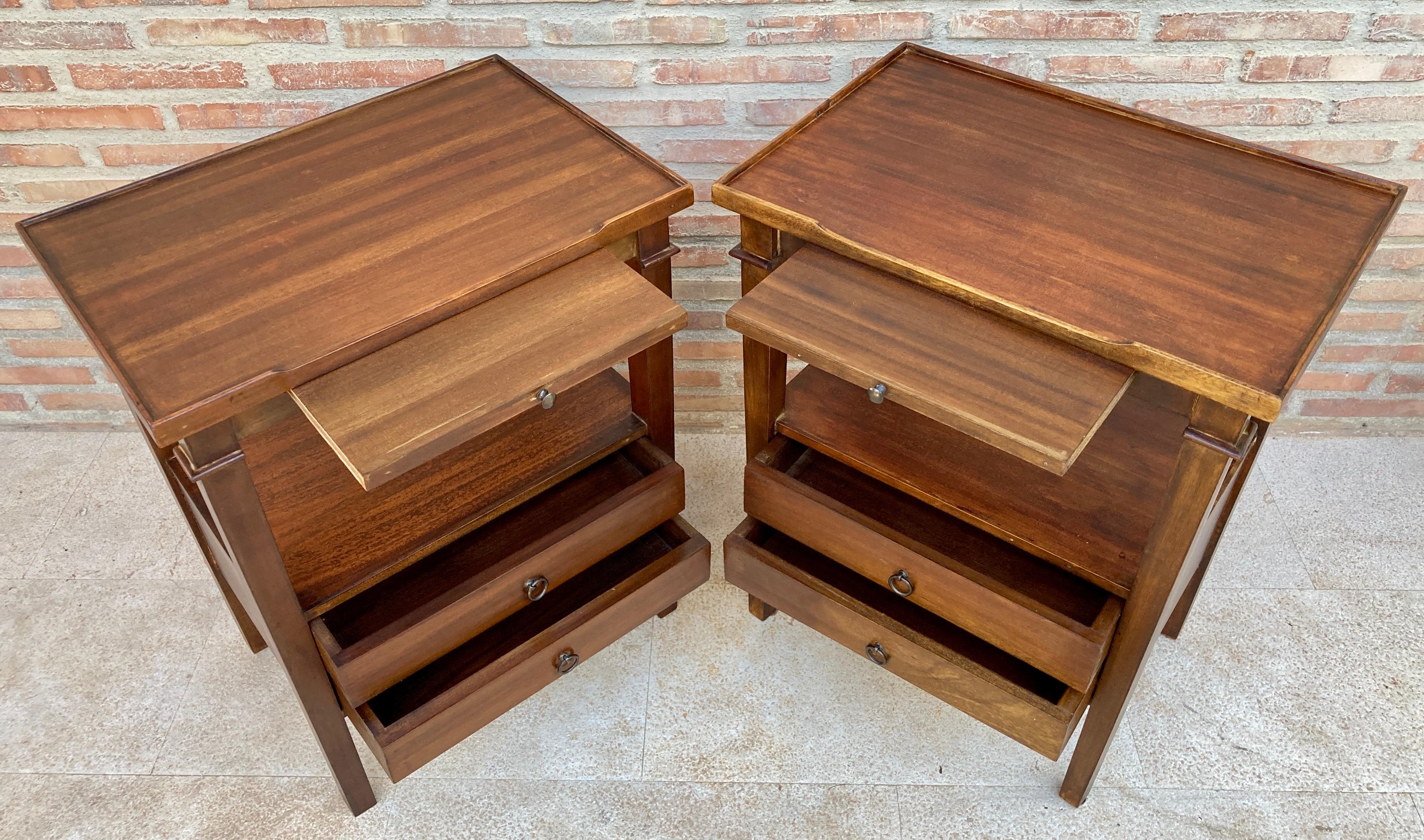 Early 20th Century Pair of French walnut nightstands or side tables with One Removable Shelf and Two Drawers. 
Pair of early 20th century French walnut nightstands or side tables. 
A pair of fine French nightstands or walnut nightstands. Each one