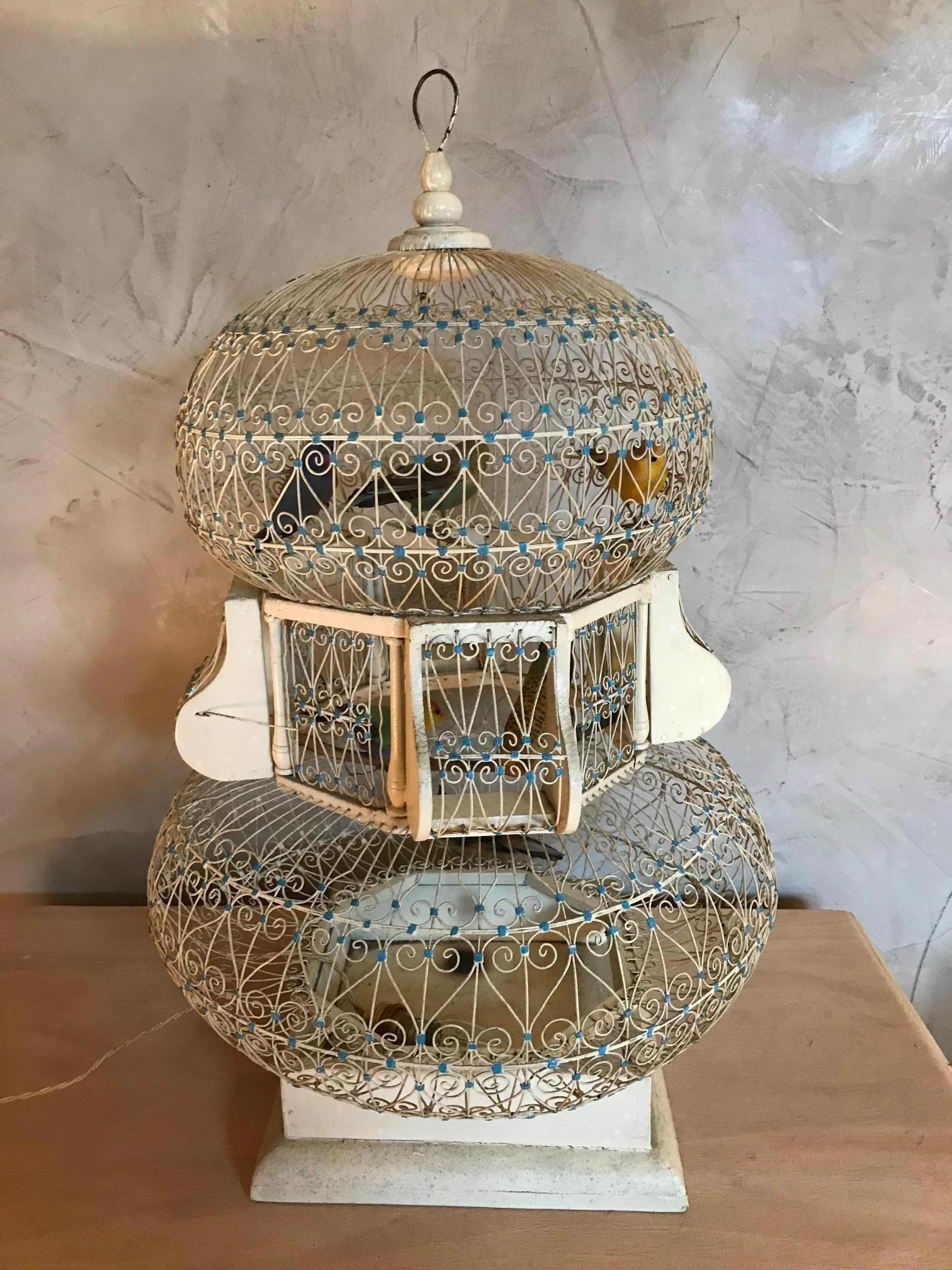 Beautiful 20th century French white metal bird cage from the 1920s.
Many birds in the cage. There is an opening door to move the birds.
We put a bulb on the bottom to enlightened the cage, that make a beautiful light.
Very nice quality.